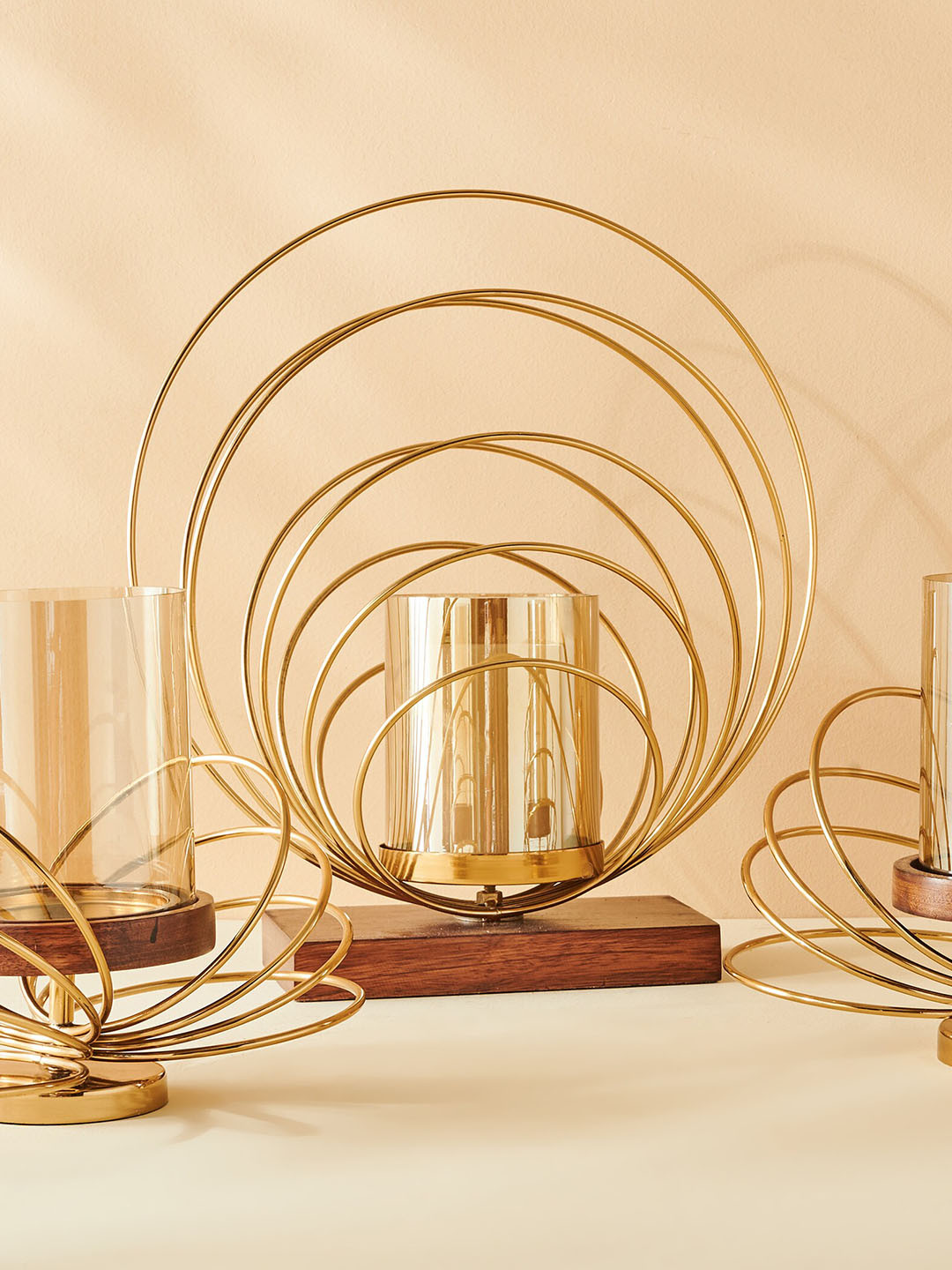 

Home Centre Gold Toned Hurricane With Rings Candle Holder