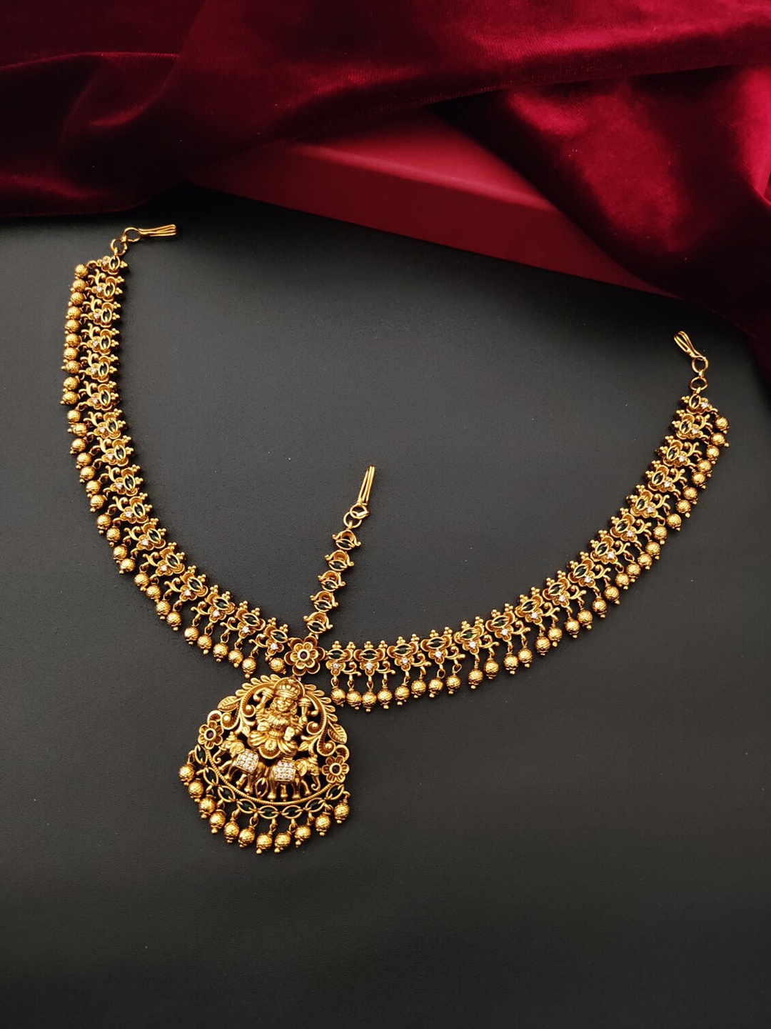 

Pihtara Jewels Gold-Plated Stone-Studded Temple Motif Designed Copper Mathapatti