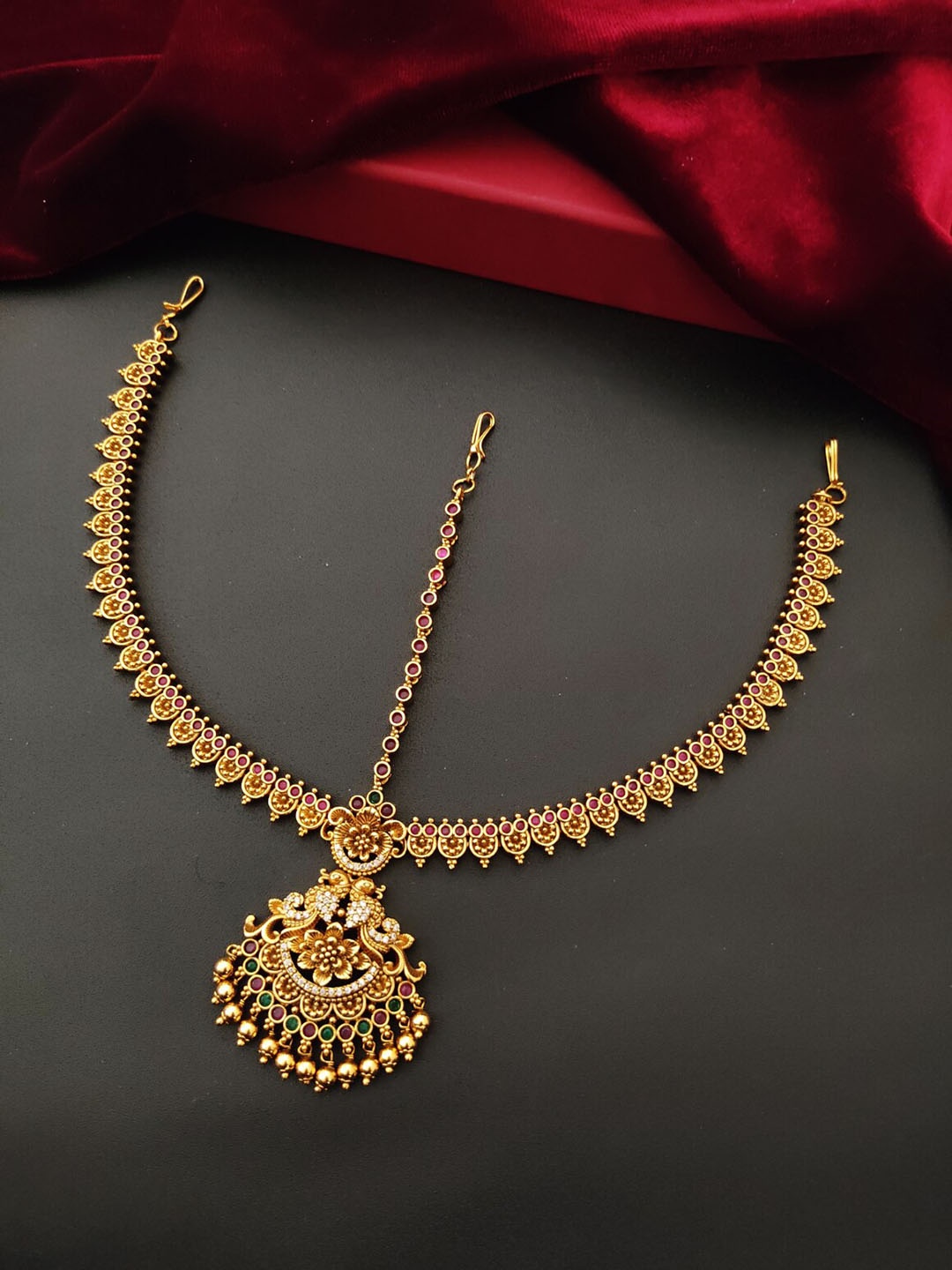 

Pihtara Jewels Gold-Plated Stone-Studded Temple Motif Designed Copper Mathapatti
