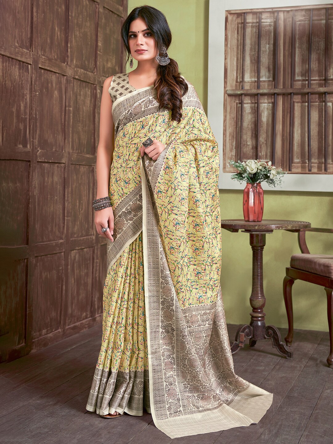 

Saree mall Yellow & Brown Ethnic Motifs Printed Sarees