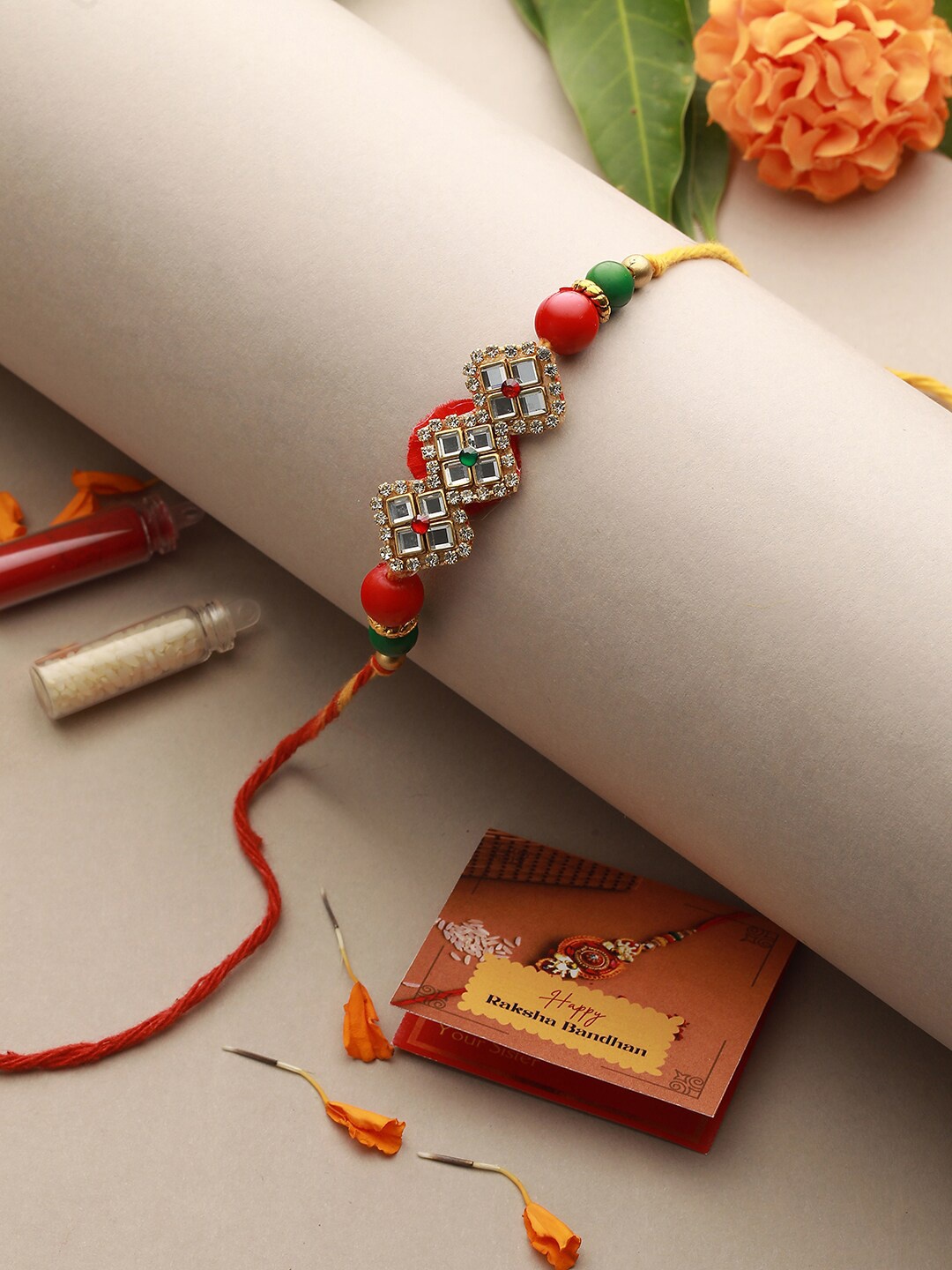 

Saraf RS Jewellery Unisex Kundan-Studded Rakhi With Roli, Rice & Greeting Card, Red