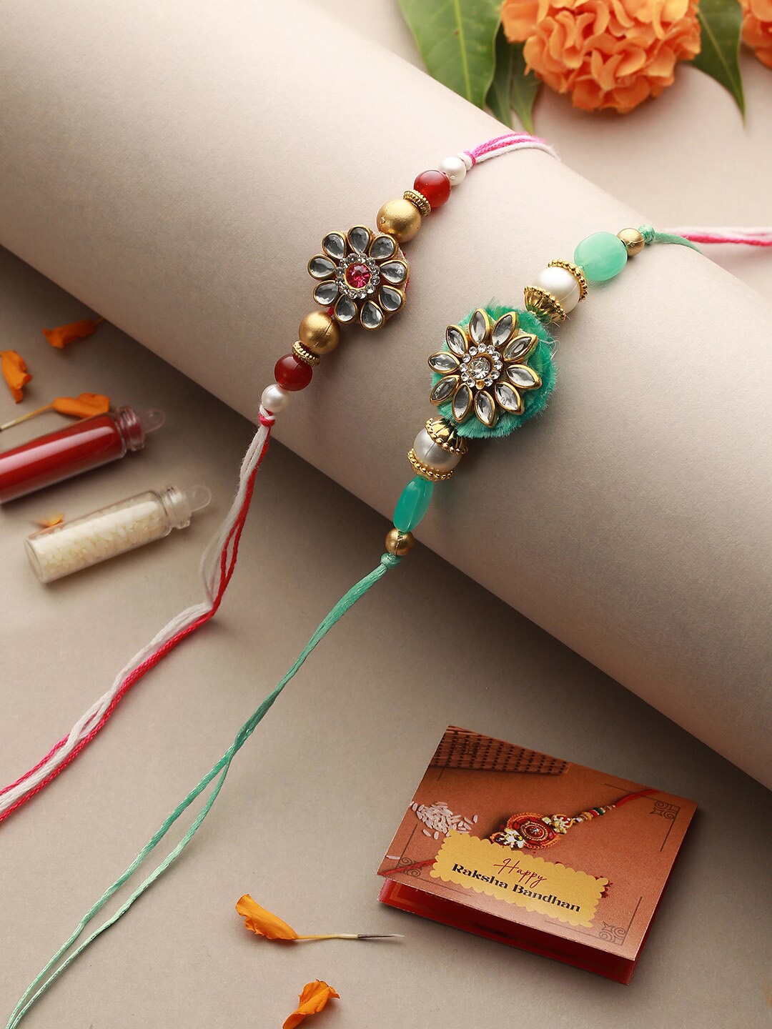 

Saraf RS Jewellery Set Of 2 Kundan & Pearl Beaded Thread Rakhis With Roli Chawal, Pink