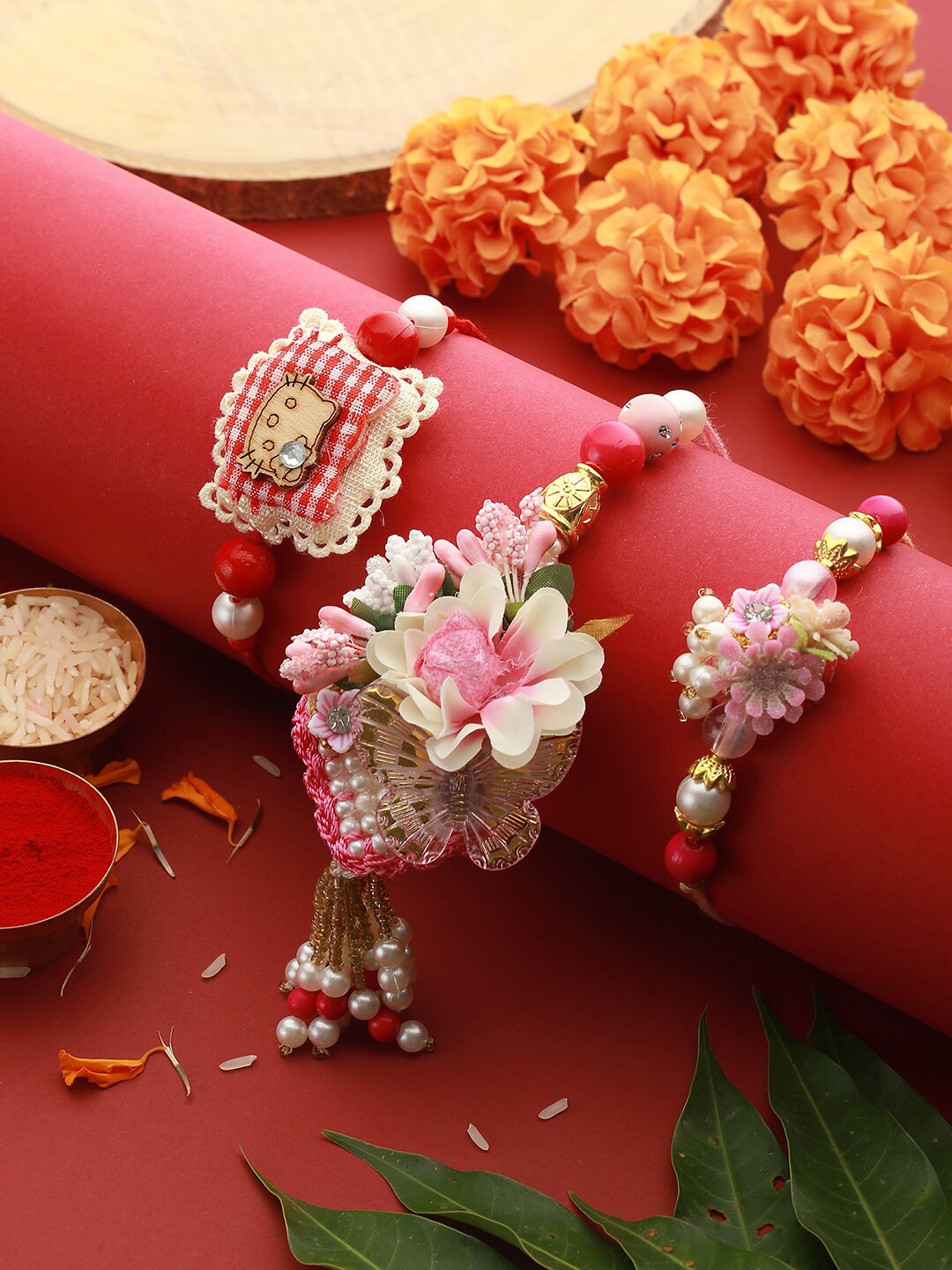 

Saraf RS Jewellery Set Of 3 Pearls Beaded Thread Rakhis, Pink