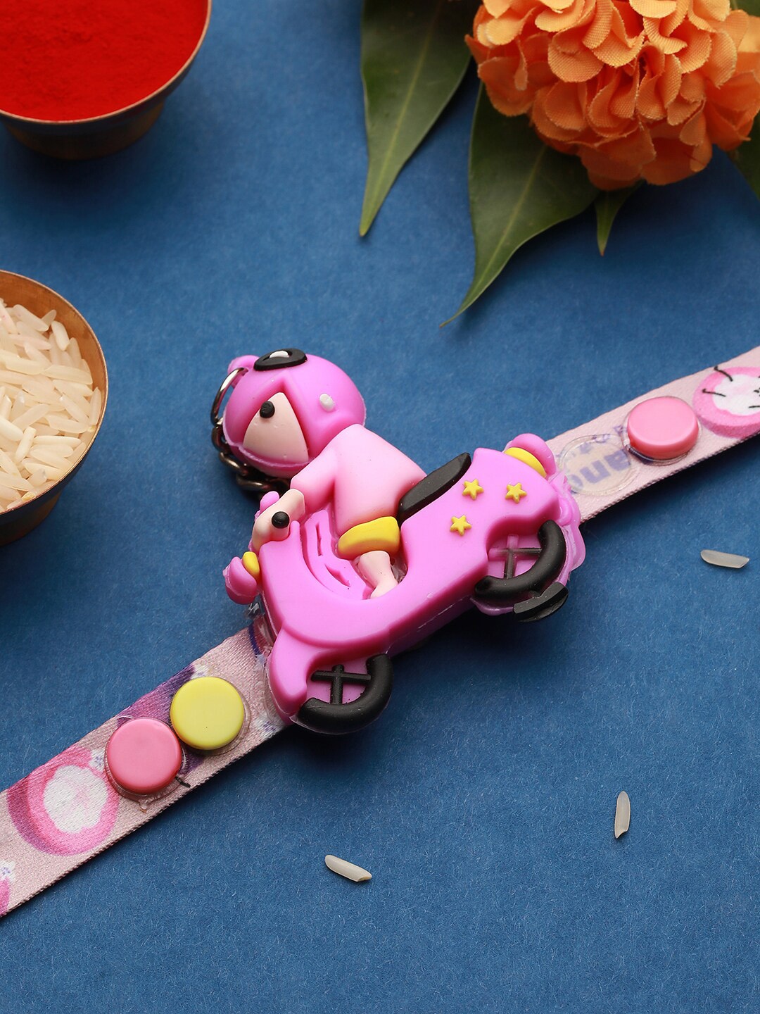 

Saraf RS Jewellery Kids Scooty Shaped Toy Rakhi, Pink