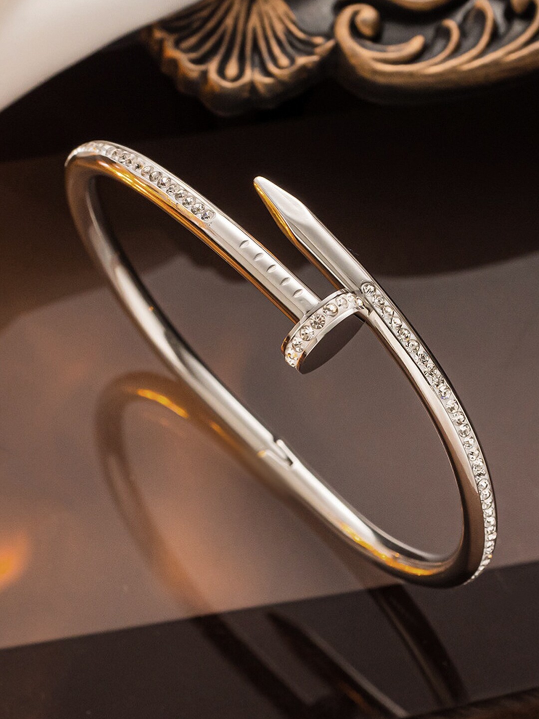 

Jewels Galaxy Silver-Plated AD Studded Cuff Nail Bracelet