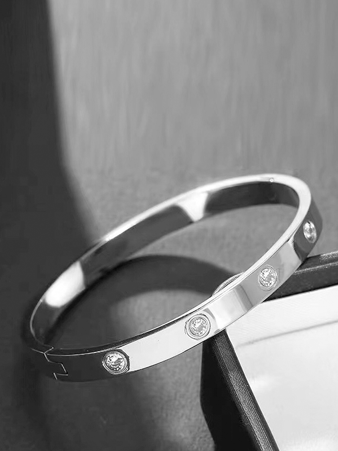 

Jewels Galaxy Women Silver-Toned Silver-Plated Bangle-Style Bracelet