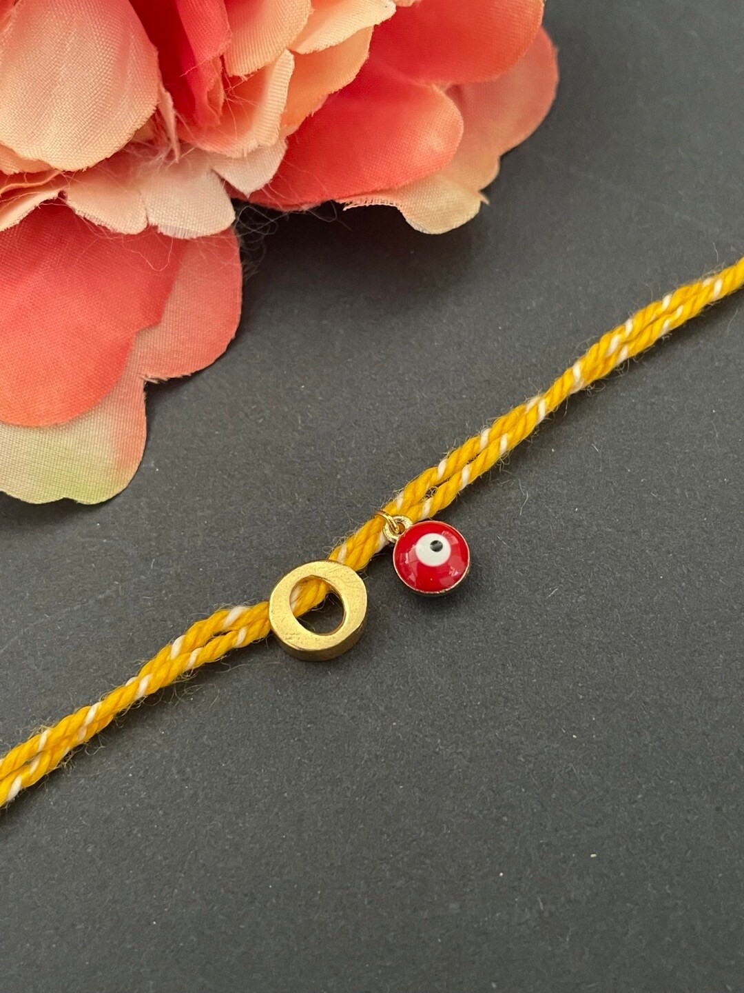 

Digital Dress Room O Alphabet & Evil Eye Charm Rakhi, Gold
