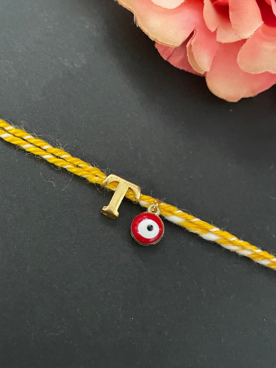 

Digital Dress Room Evil Eye & Letter T Charm Rakhi Bracelet, Gold