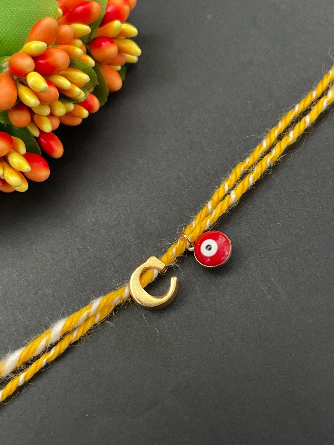 

Digital Dress Room Gold Plated Letter "C" Initial & Evil Eye Charm Rakhi