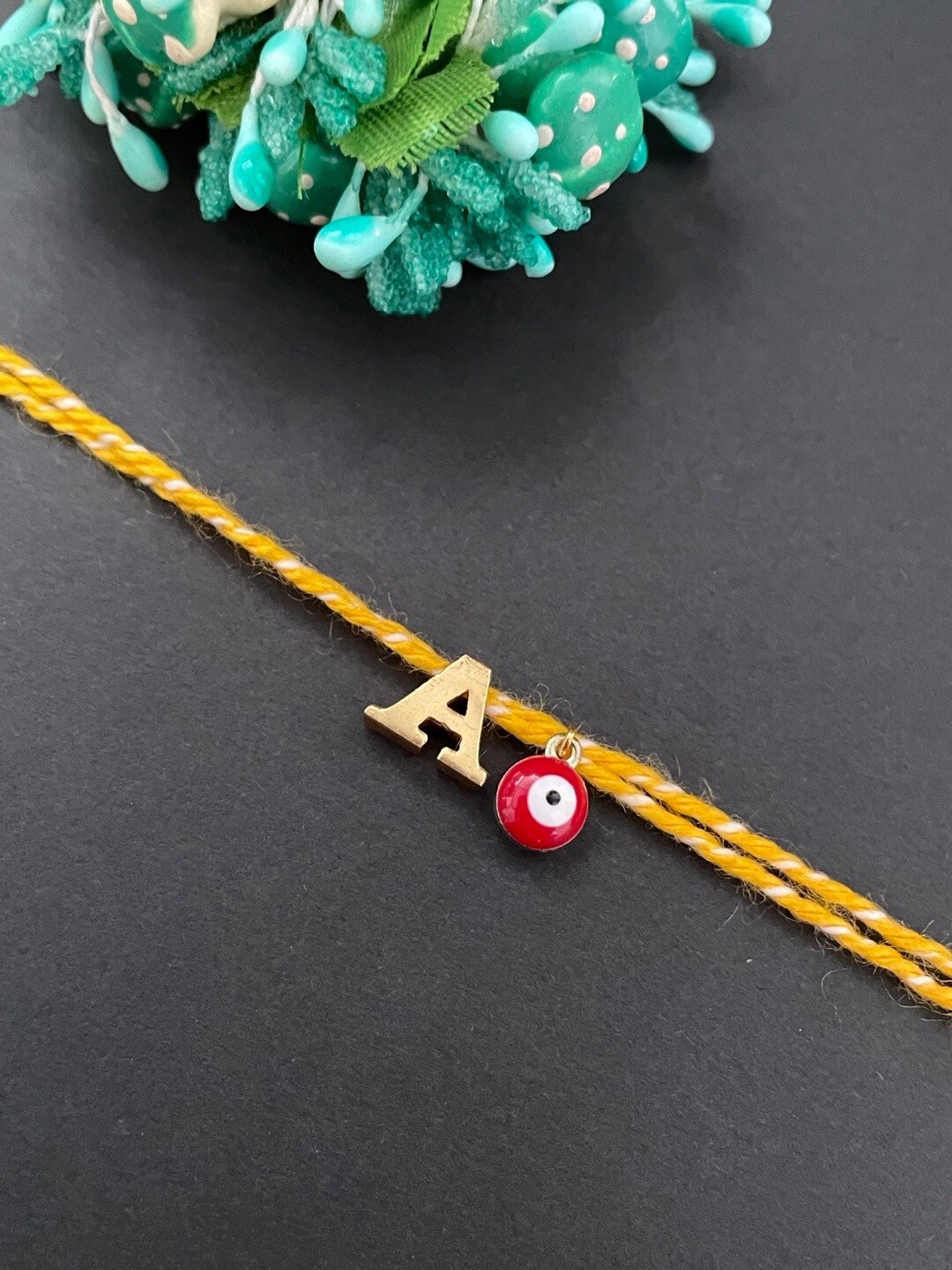 

Digital Dress Room Gold Plated Letter "A" Initial & Evil Eye Charm Rakhi