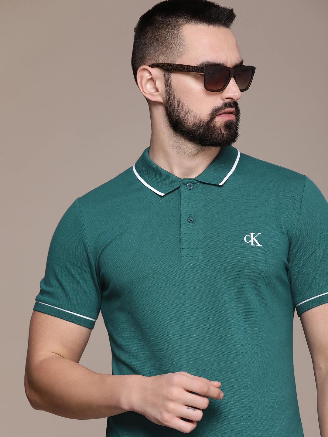 

Calvin Klein Jeans Solid Polo Collar Slim Fit Casual T-shirt, Teal