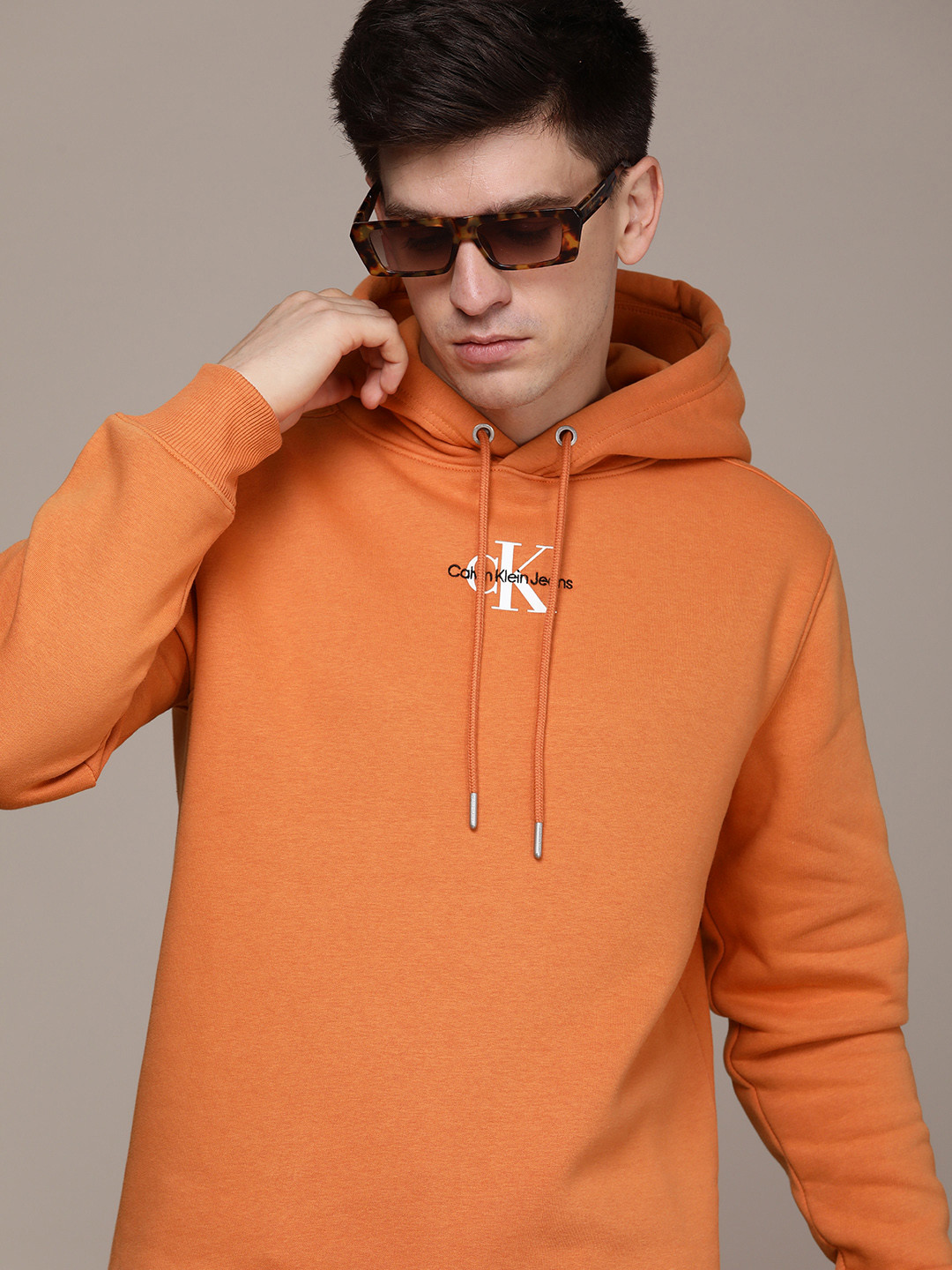 

Calvin Klein Jeans Minimal Brand Logo Embroidered Detail Hooded Sweatshirt, Orange