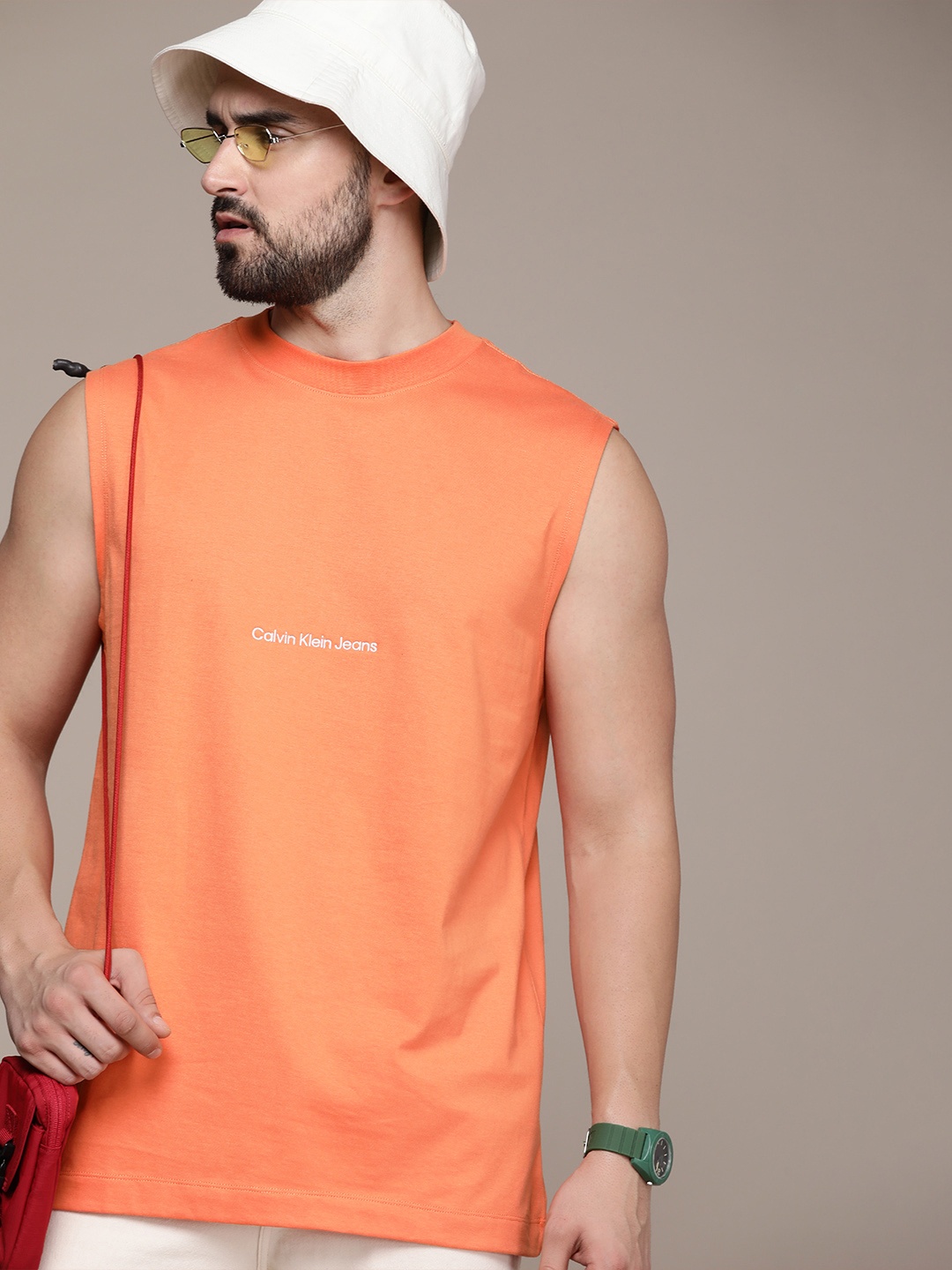 

Calvin Klein Jeans Pure Cotton Round Neck Solid Sleeveless Casual T-shirt, Orange