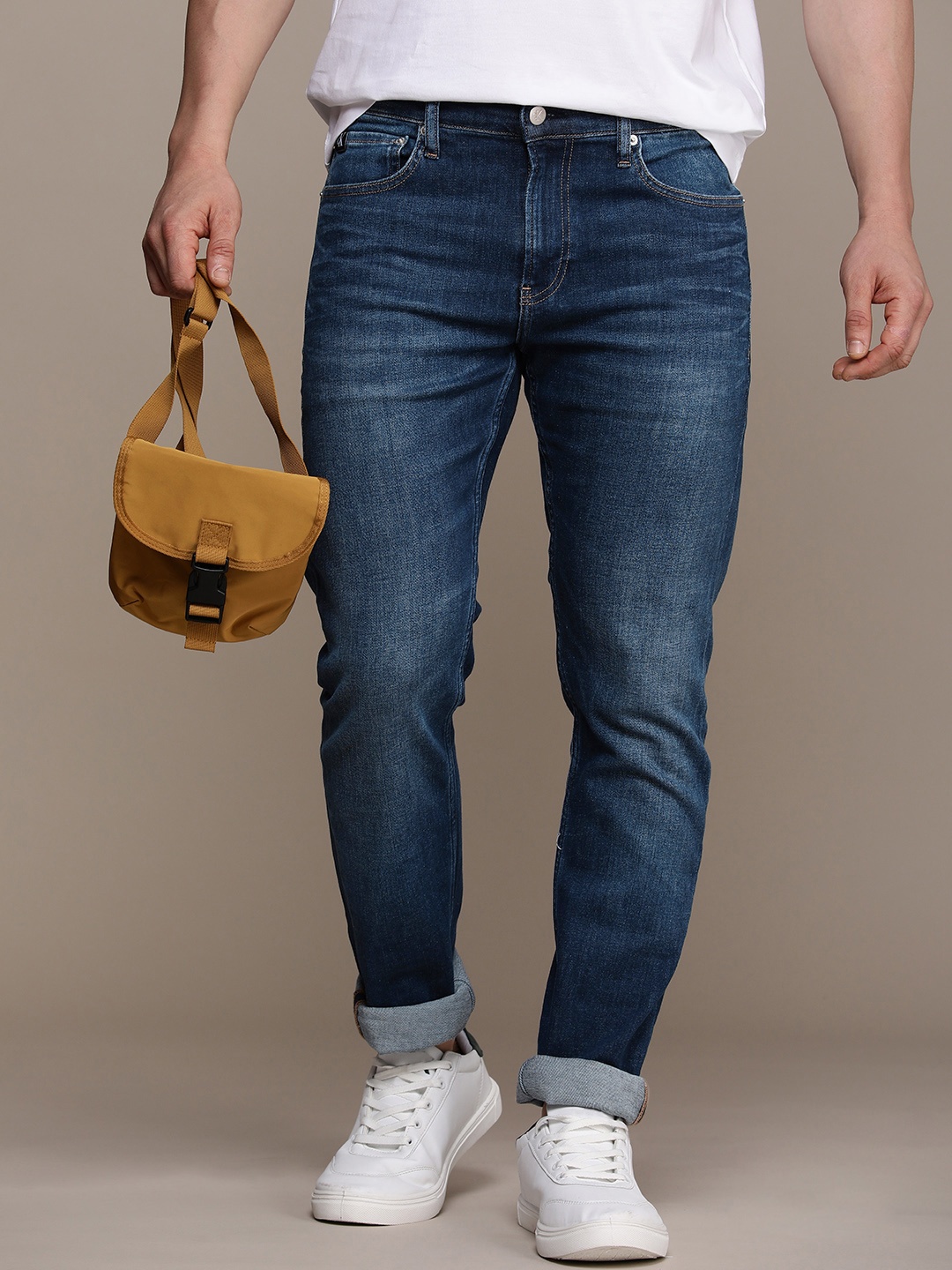 

Calvin Klein Jeans Men Slim Fit Light Fade Stretchable Mid-Rise Jeans, Blue