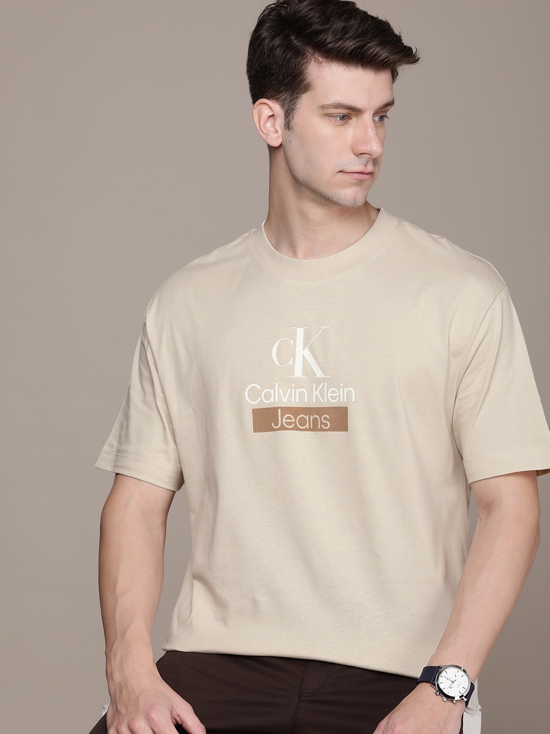 

Calvin Klein Jeans Pure Cotton Brand Logo Printed Drop-Shoulder Sleeves Boxy Fit T-shirt, Beige