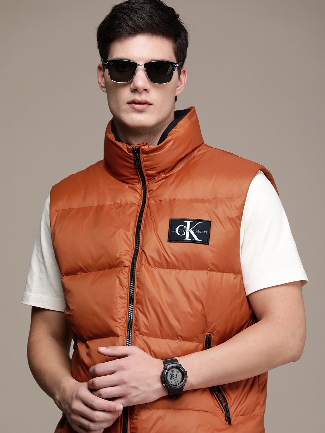 

Calvin Klein Jeans Mock Collar Sleeveless Puffer Jacket With Applique Detail, Orange