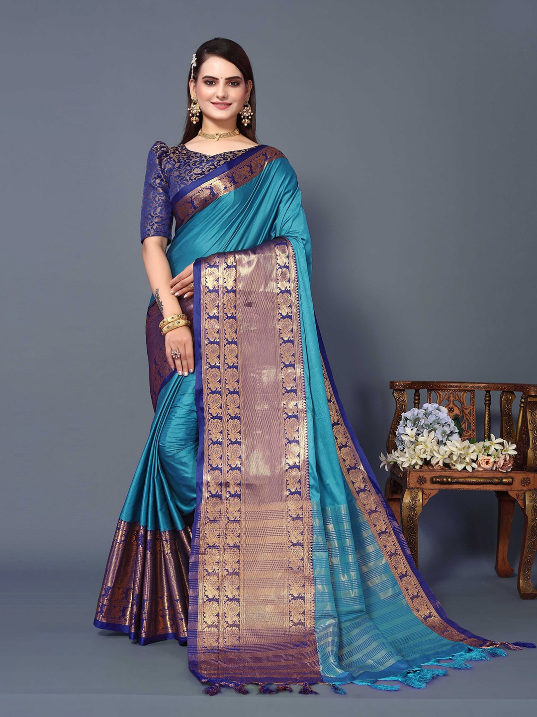 

Mitera Blue & Purple Ethnic Motifs Woven Design Zari Silk Cotton Banarasi Saree