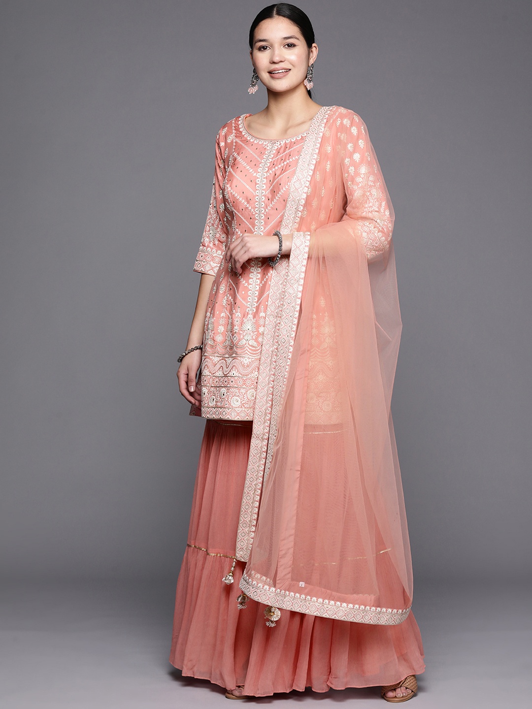 

Libas Art Embroidered Pure Silk Kurti with Sharara & Dupatta, Peach