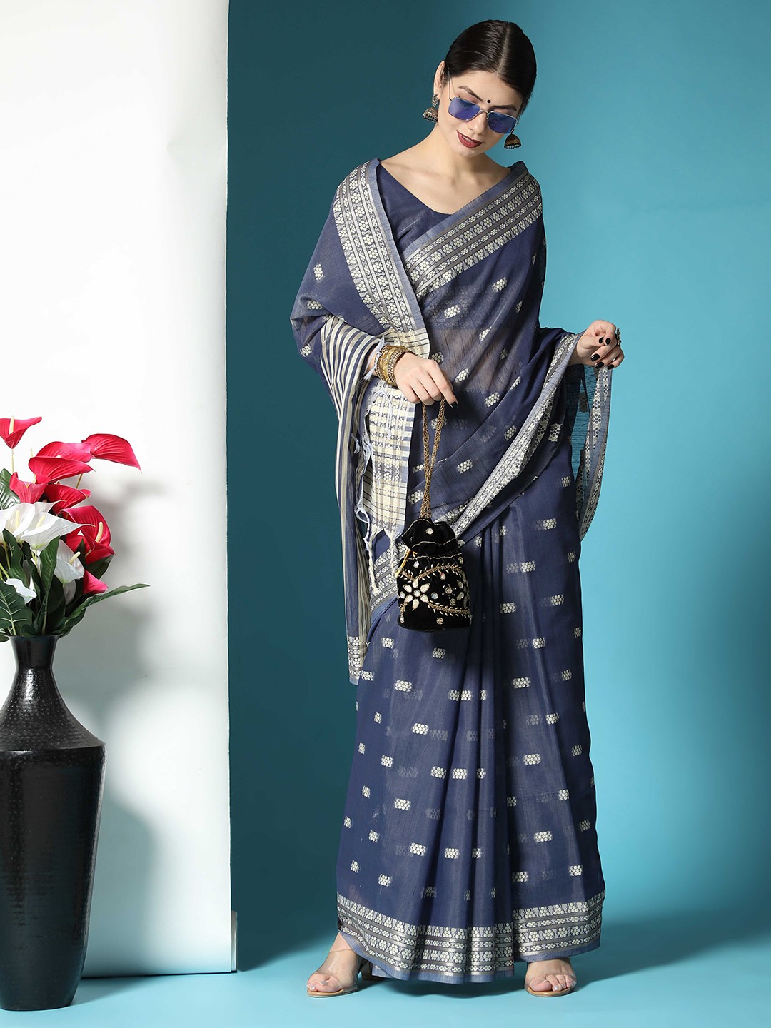 

Mitera Navy Blue & Silver-Toned Ethnic Motif Woven Design Zari Saree