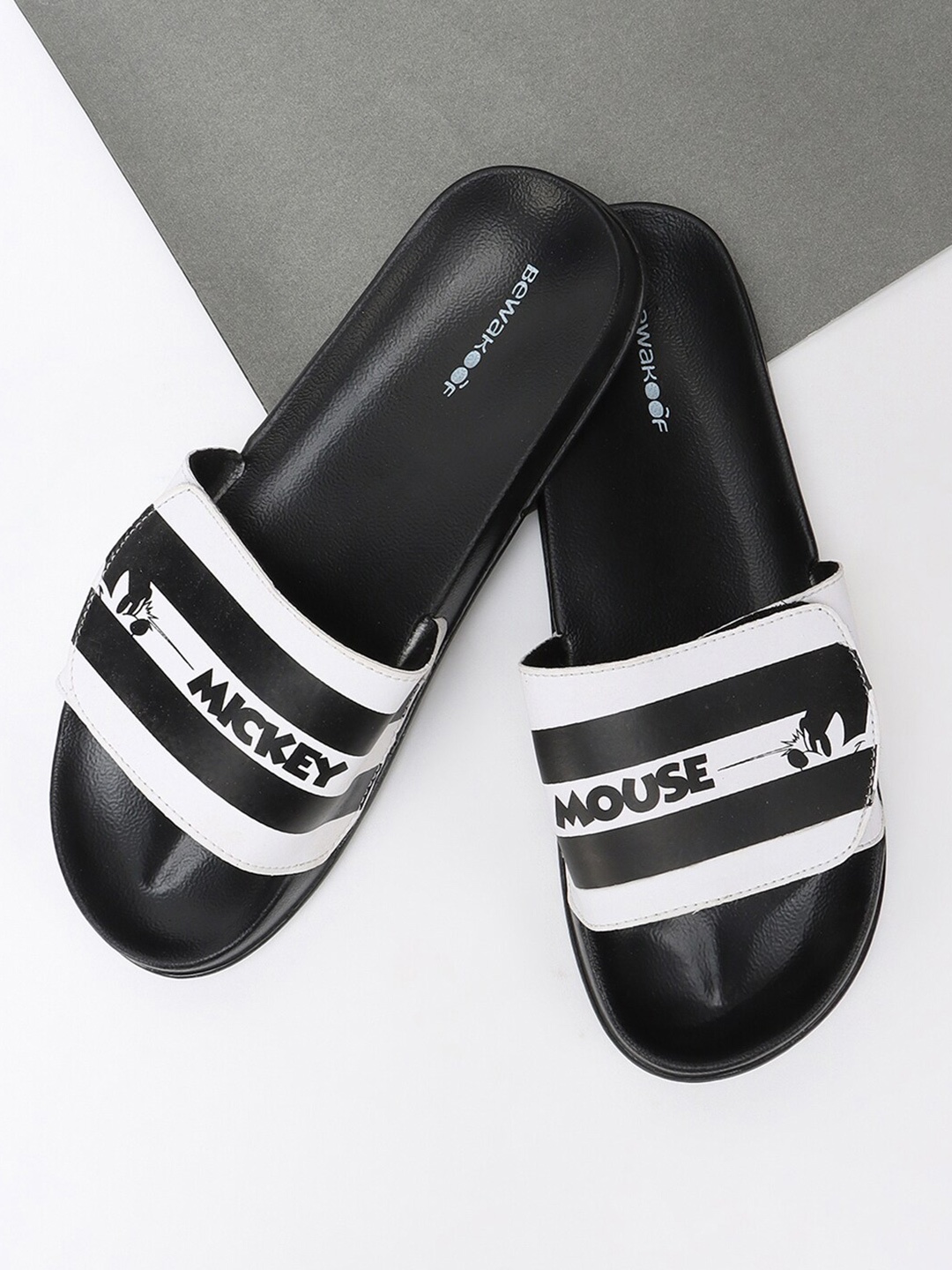 

Bewakoof Men Black & White Striped Sliders