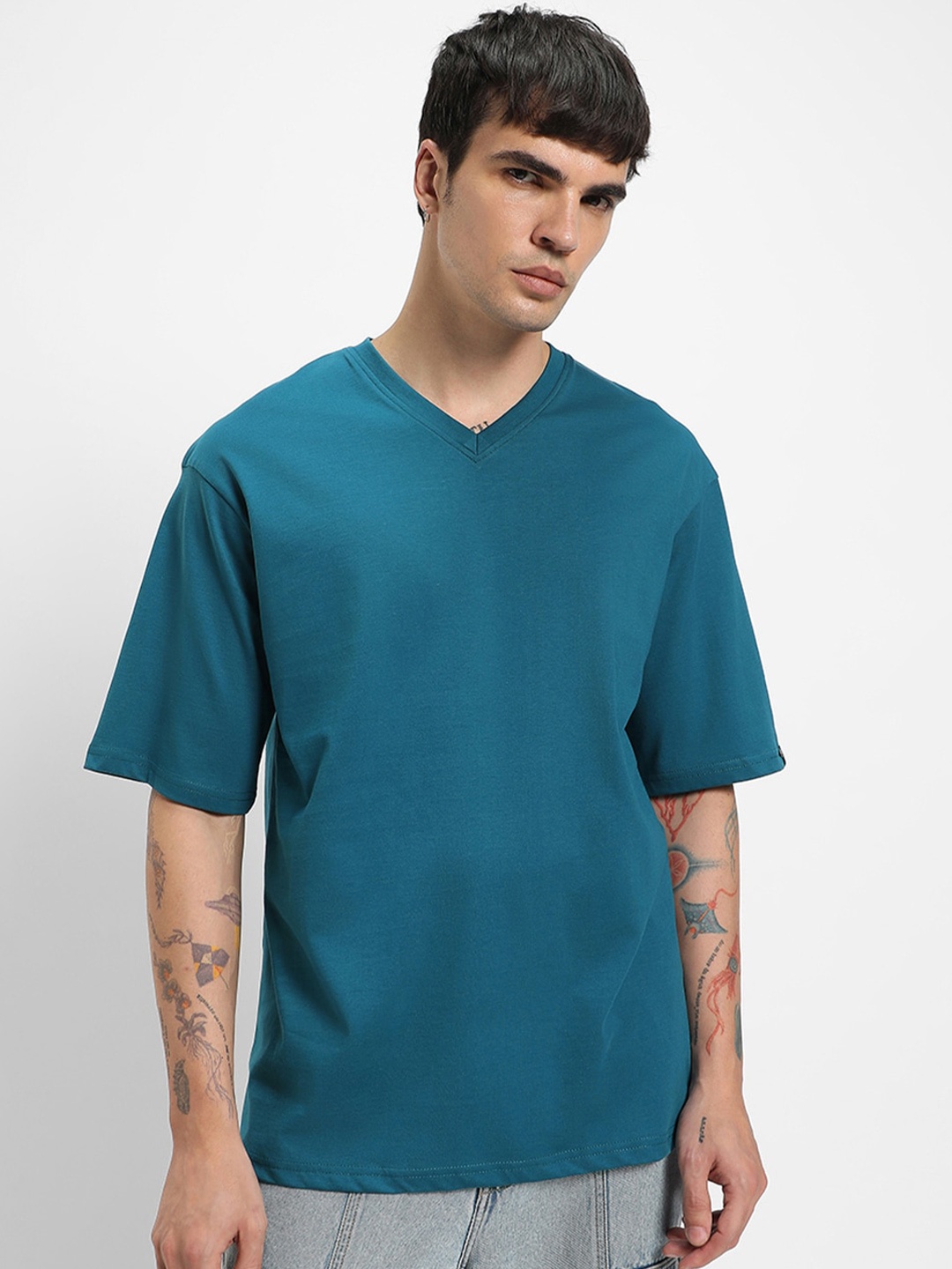 

Bewakoof V-Neck Drop Shoulder Oversized Pure Cotton T-Shirt, Teal