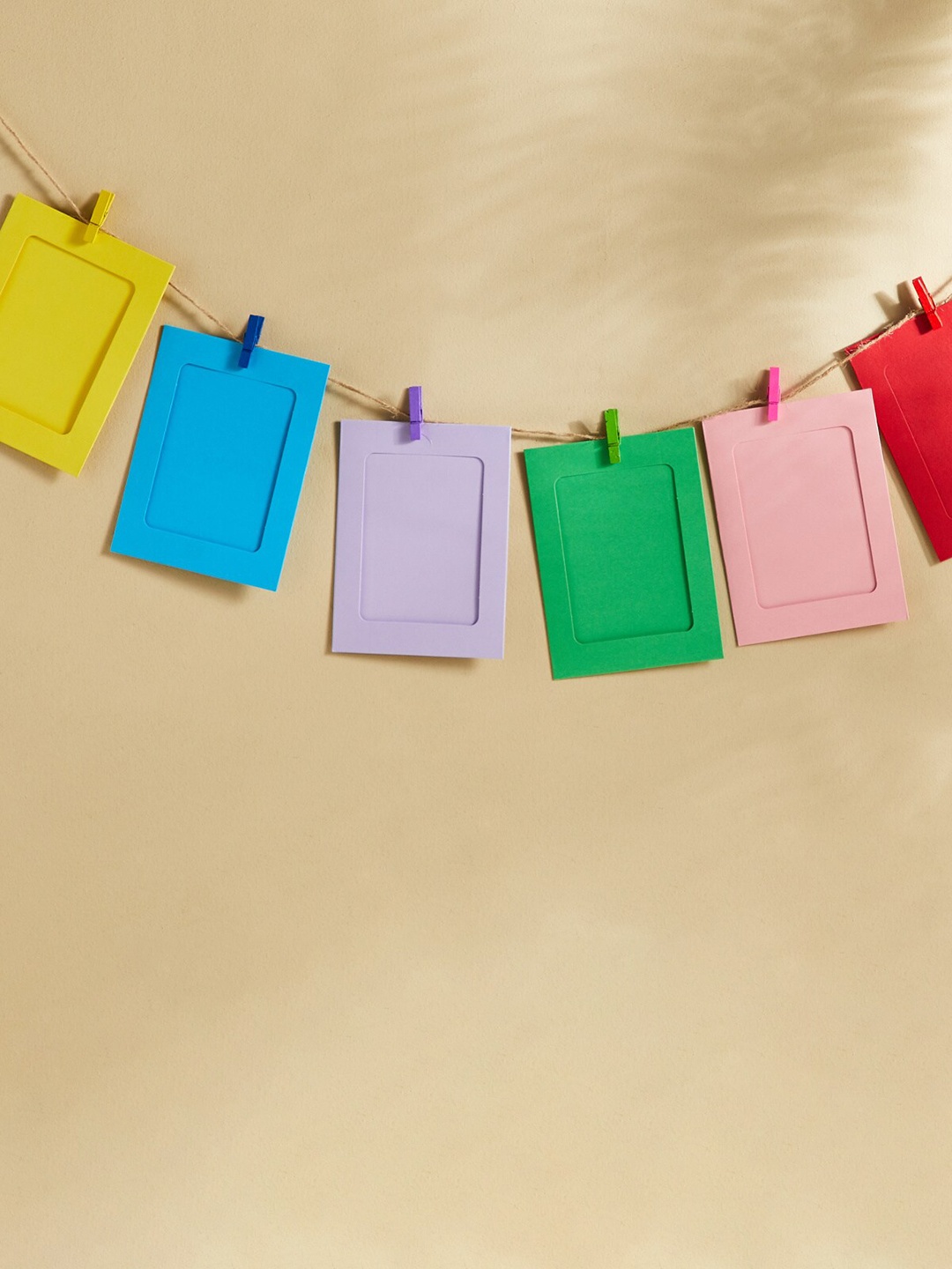 

Home Centre Green & Yellow 10 Pieces Hanging Photo Frames