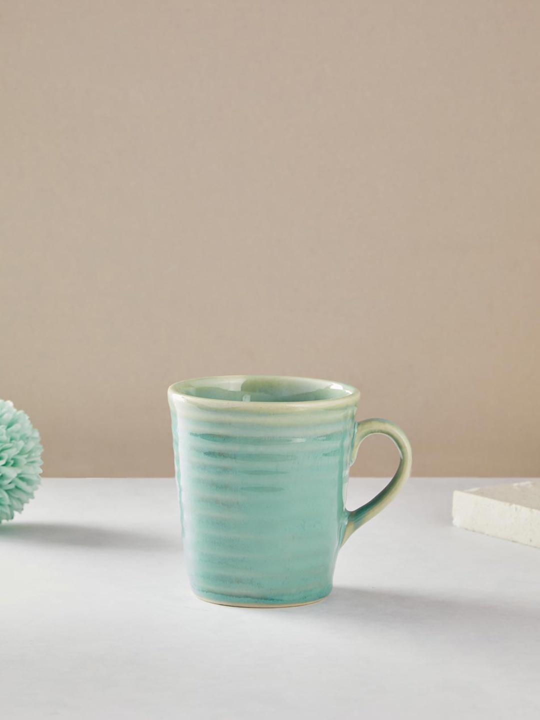 

Fabindia Adhrit Turquoise Blue Textured Ceramic Matte Mug - 350 ml