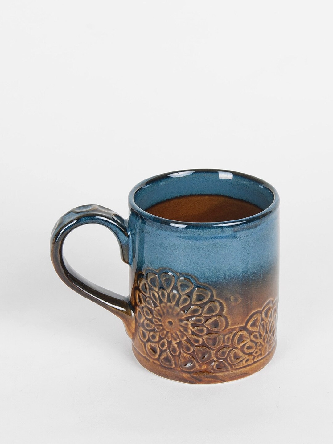 

Fabindia Amber Sadyanta Brown & Blue Textured Ceramic Matte Mug - 360 ml