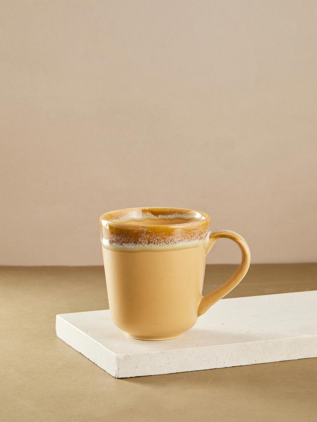 

Fabindia Anaarbagh Yellow & Brown Printed Ceramic Glossy Mug - 300 ml