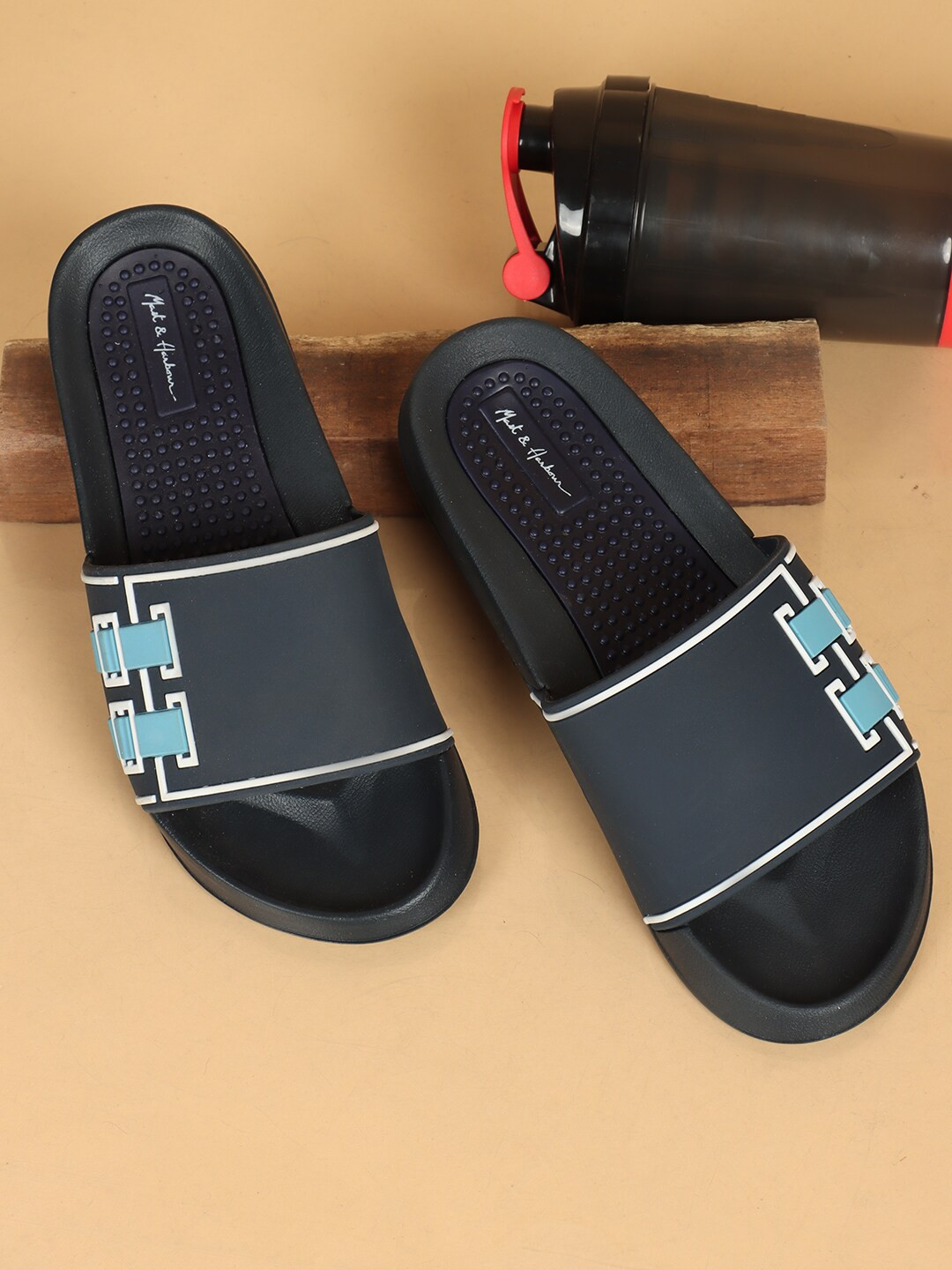 

Mast & Harbour Men Navy Blue & White Printed Sliders