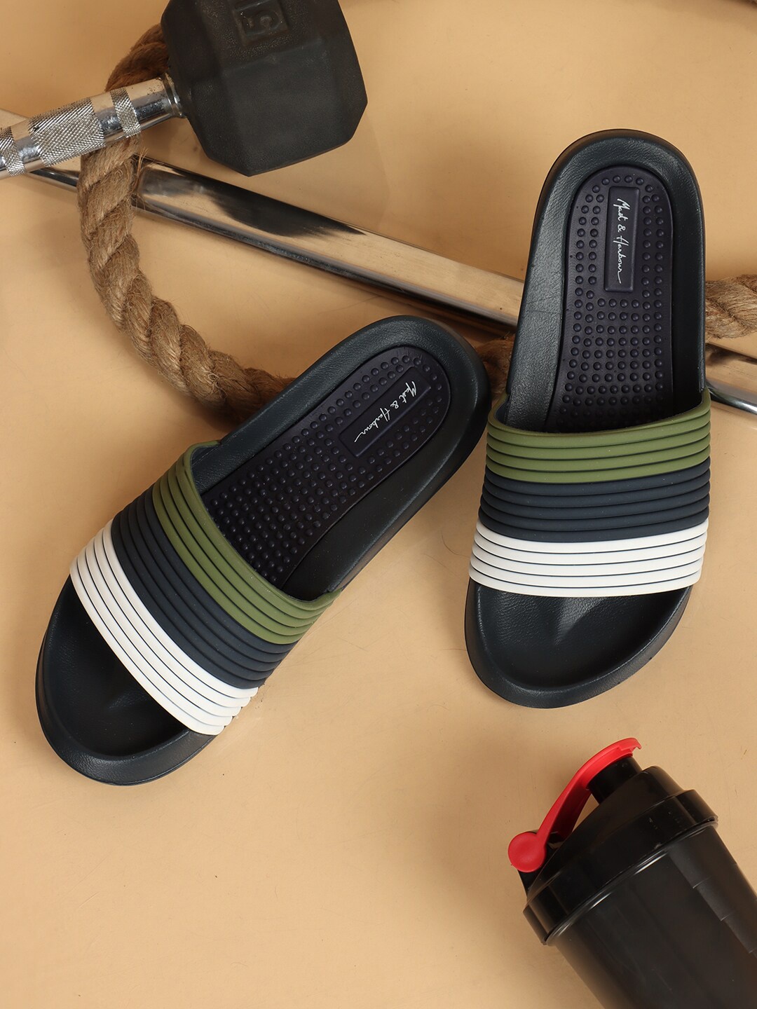 

Mast & Harbour Men Navy Blue & Olive Green Colourblocked Sliders