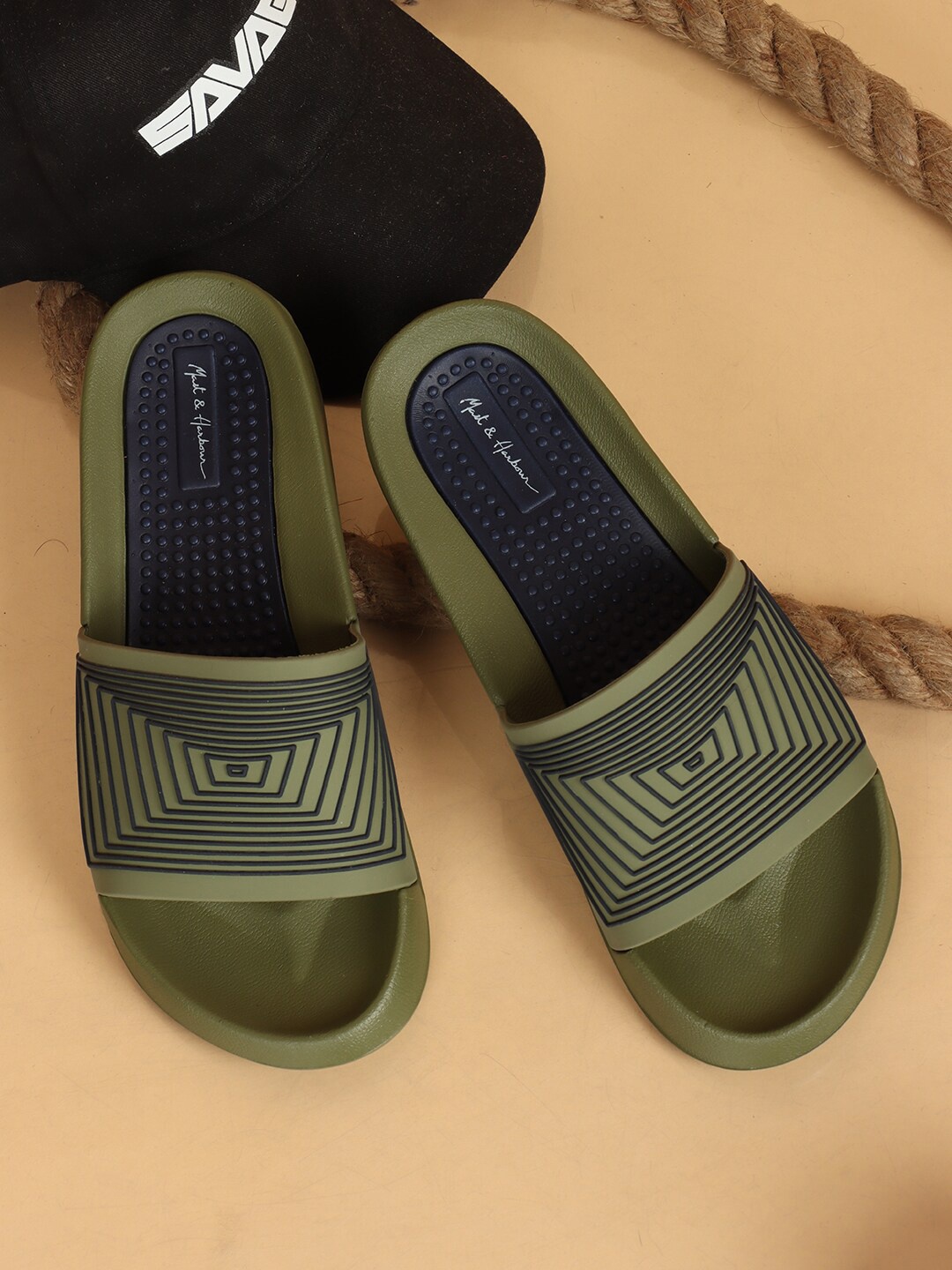 

Mast & Harbour Men Olive Green & Black Self Design Sliders