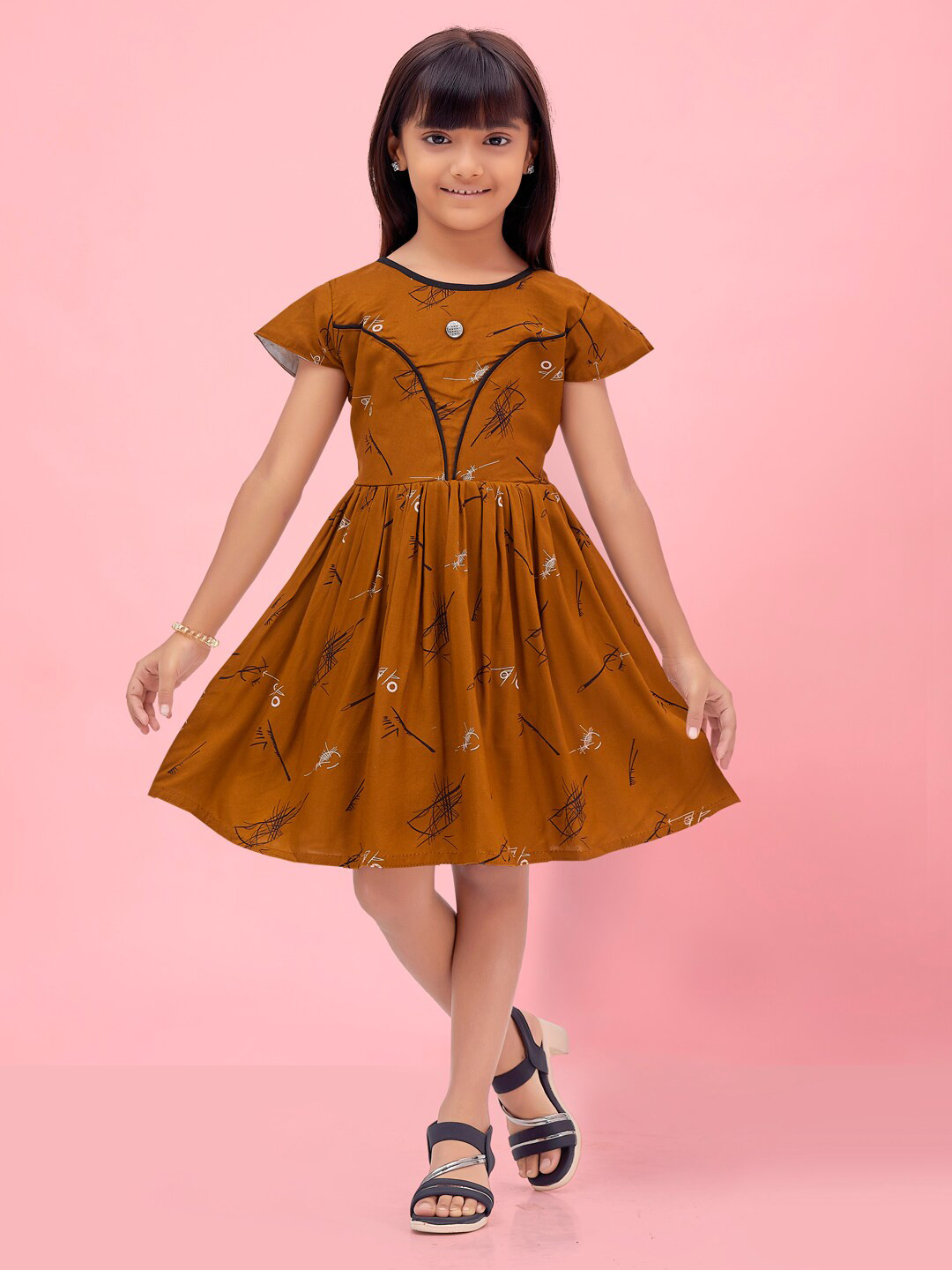 

Aarika Girls Conversational Printed Cap Sleeves A-Line Dress, Rust