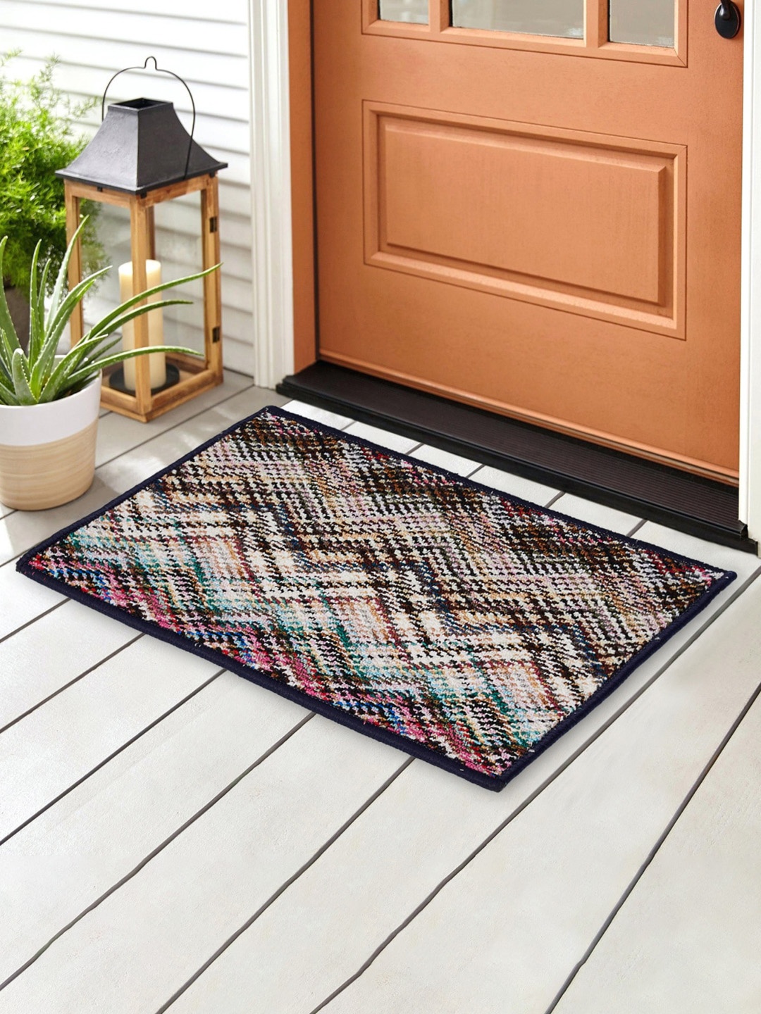 

Home Centre Fiesta Red & White Tufted Printed Doormat