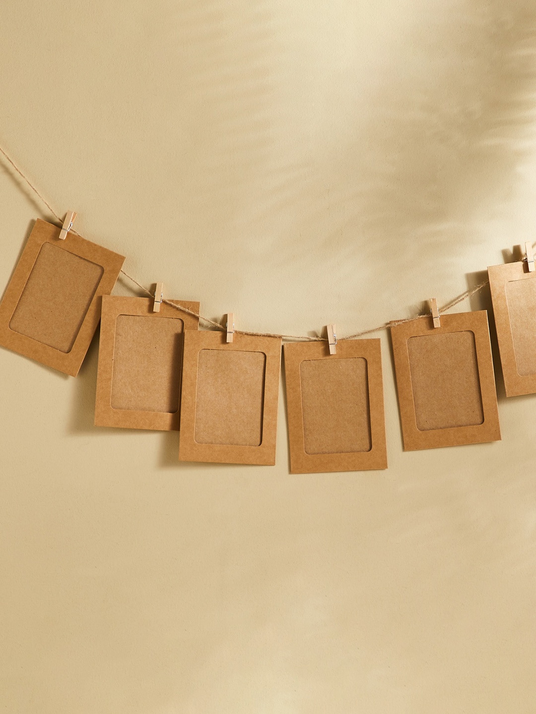 

Home Centre Brown 10 Pieces Hanging Photo Frames with String