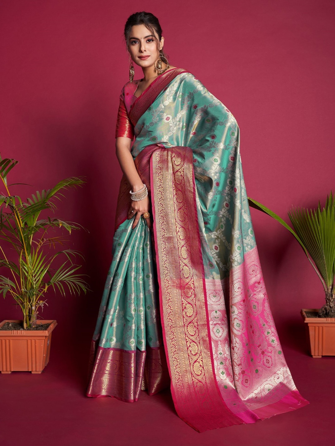 

Mitera Teal & Pink Ethnic Motifs Woven Design Zari Kanjeevaram Saree