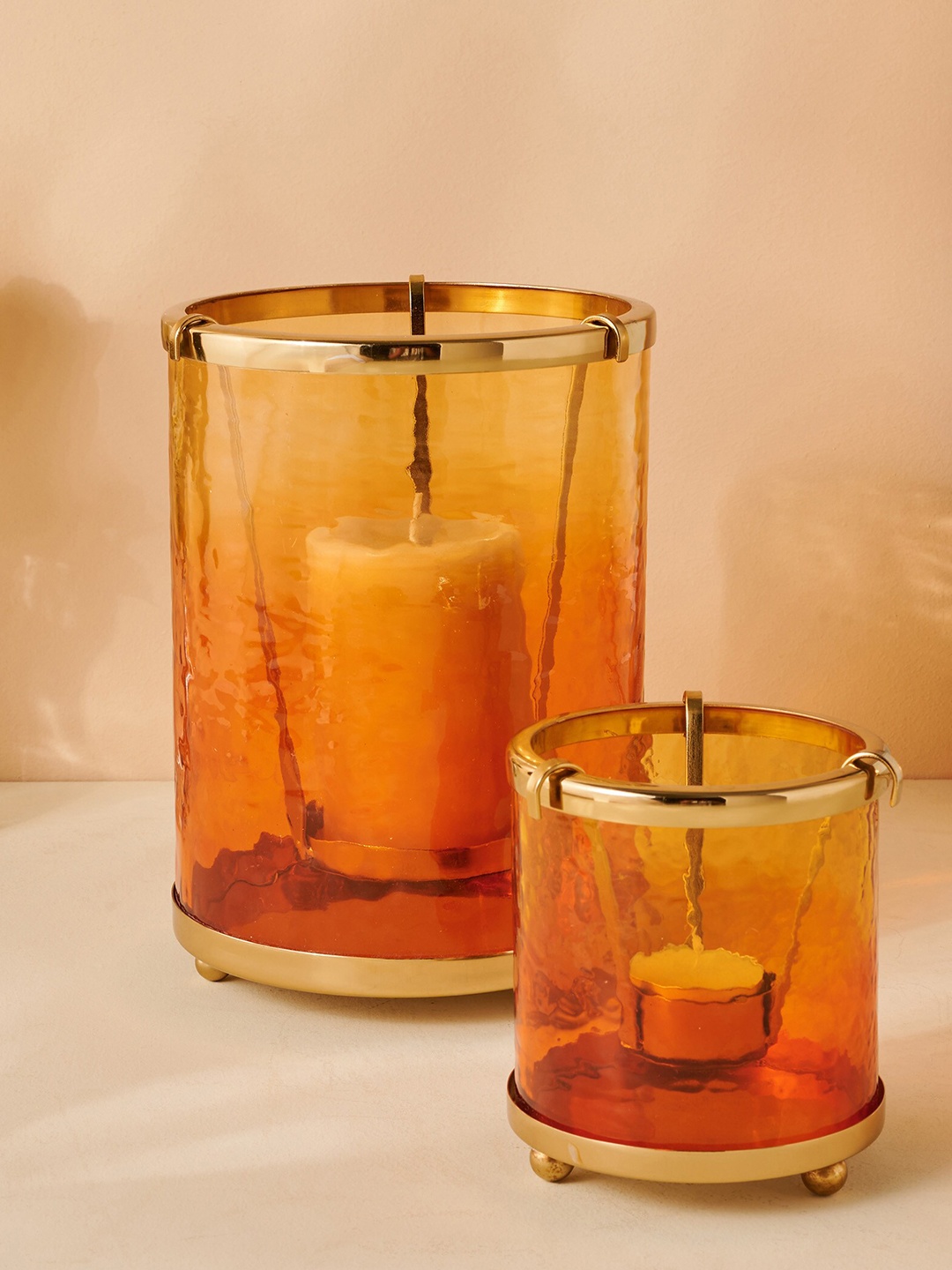 

Home Centre Rylee Gold Toned Cylindrical Shaped Glass T-Light Candle Holder