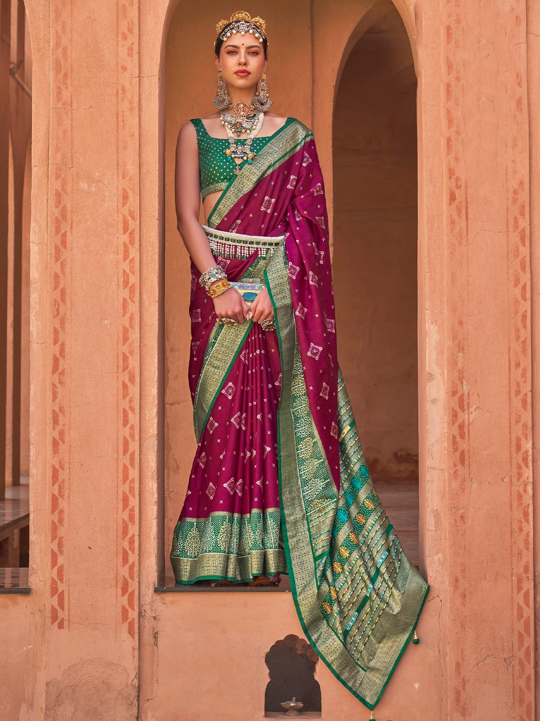 

Mitera Burgundy & Green Ethnic Motifs Woven Design Zari Patola Saree