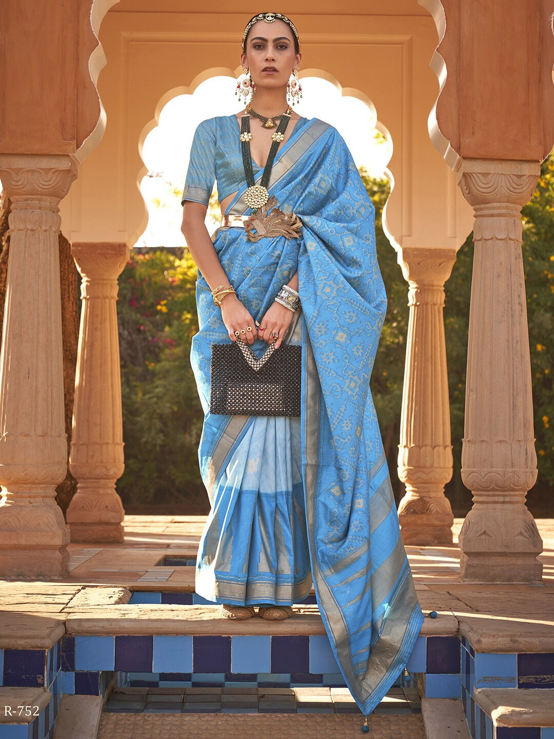 

Anouk Blue & Gold-Toned Ethnic Motifs Printed Zari Ikat Saree