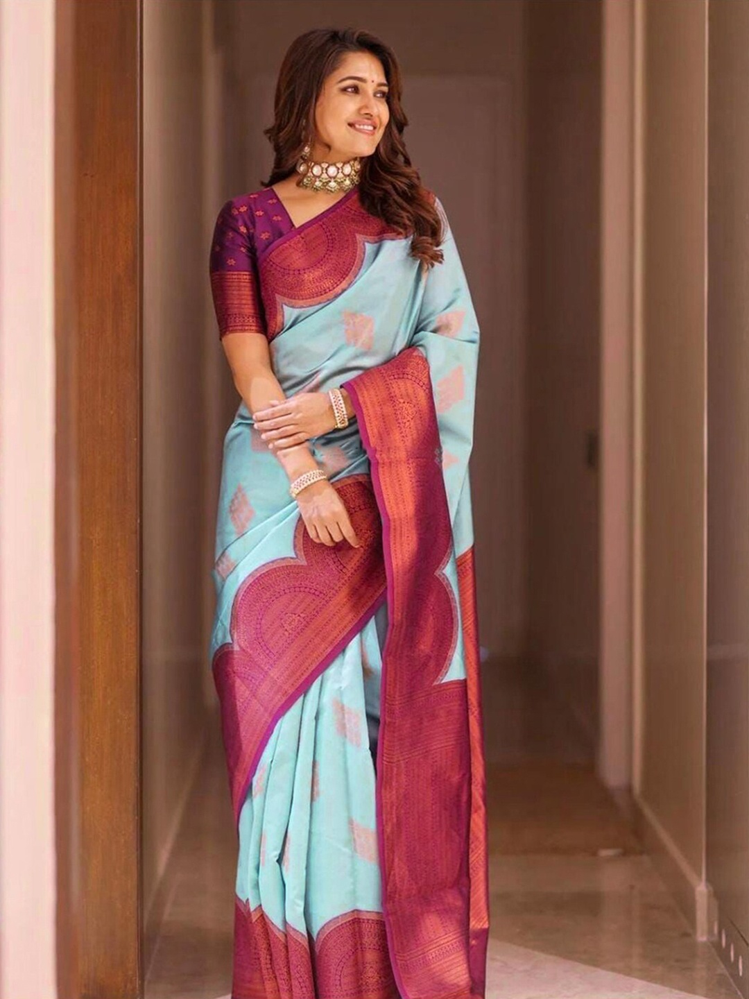 

Mitera Purple & Turquoise Blue Ethnic Motifs Woven Design Zari Banarasi Saree