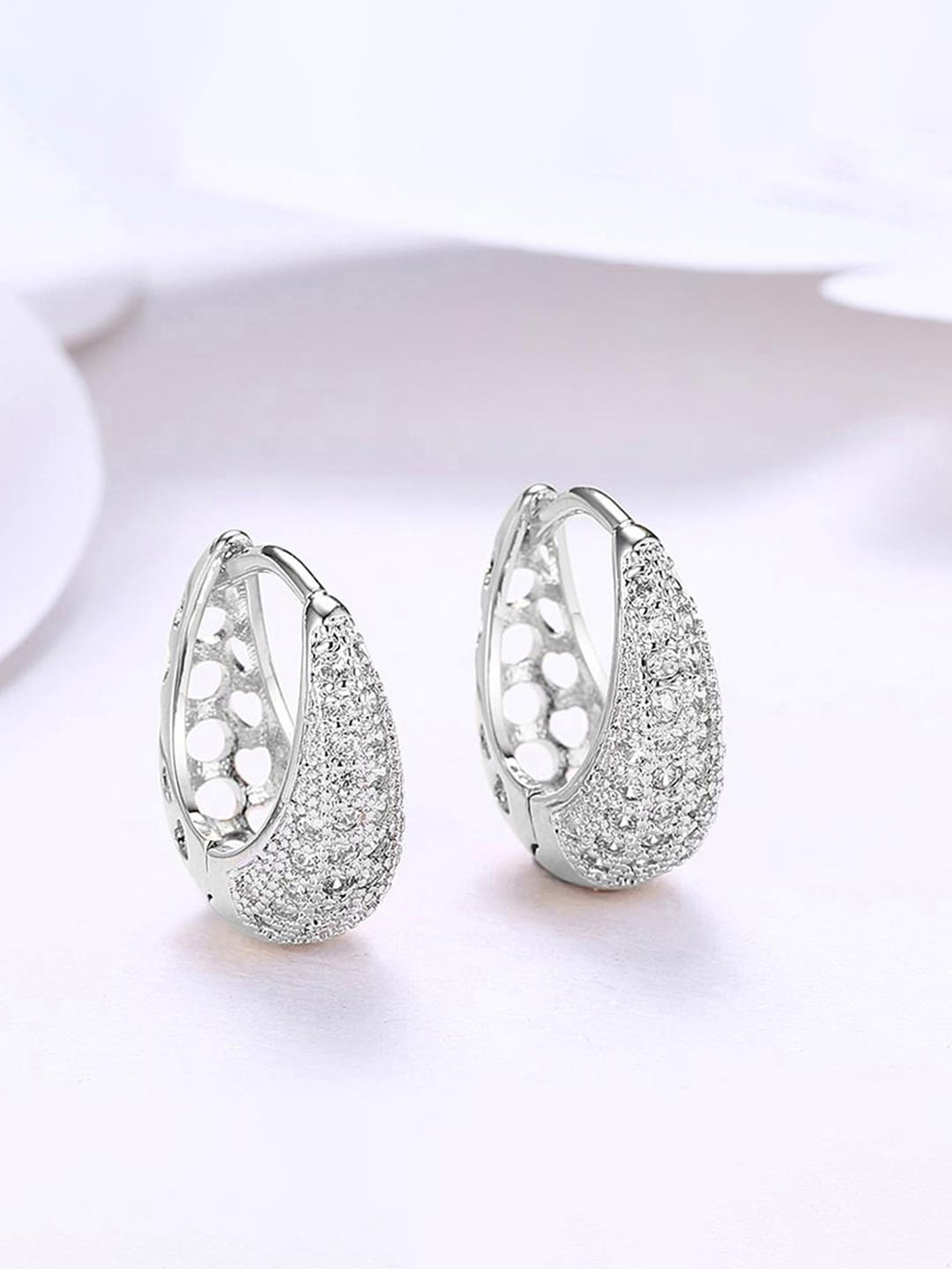 

Jewels Galaxy Silver-Plated American Diamond Studded Circular Half Hoop Earrings