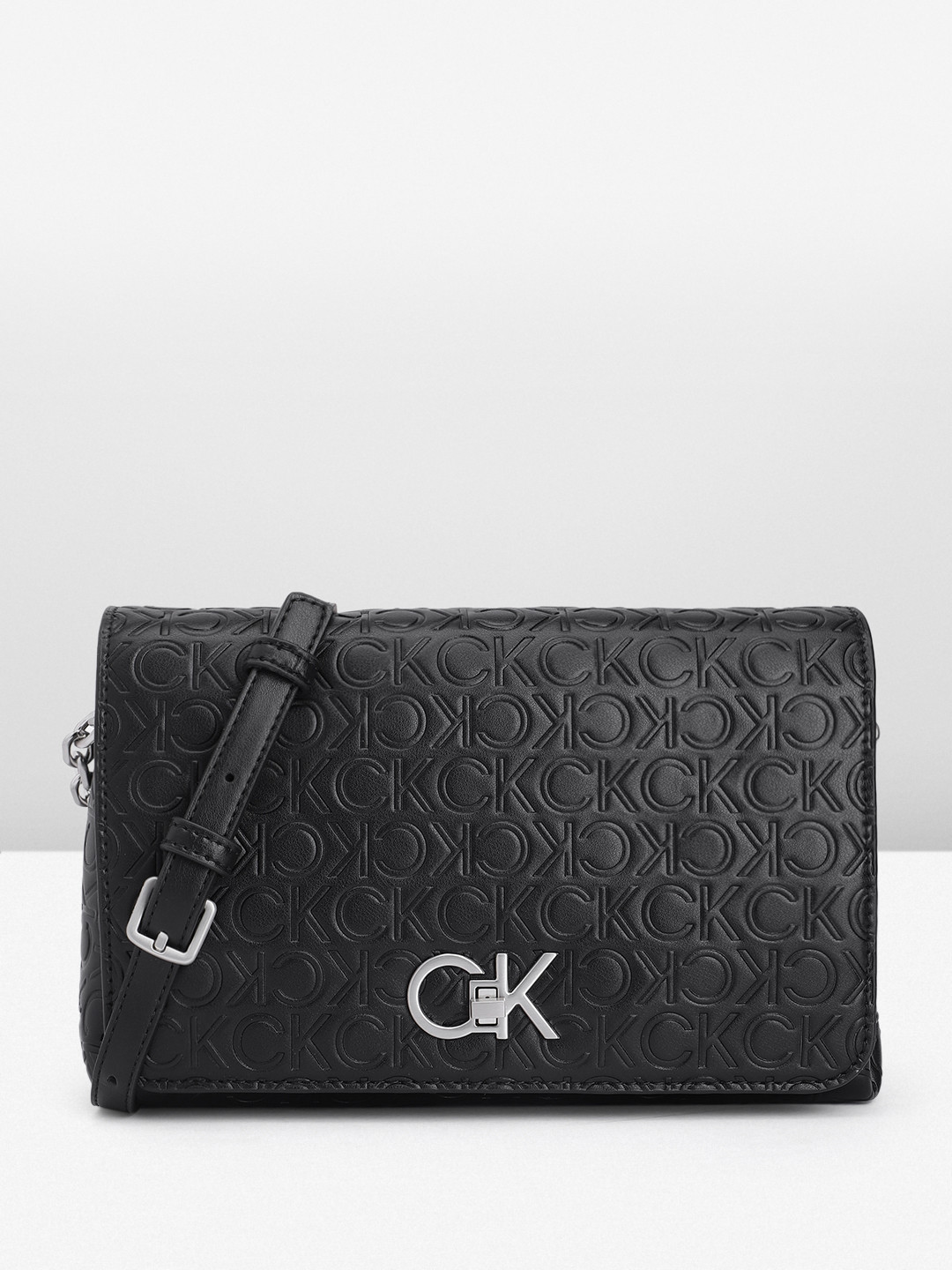 

Calvin Klein Brand Logo Textured Sling Bag, Black
