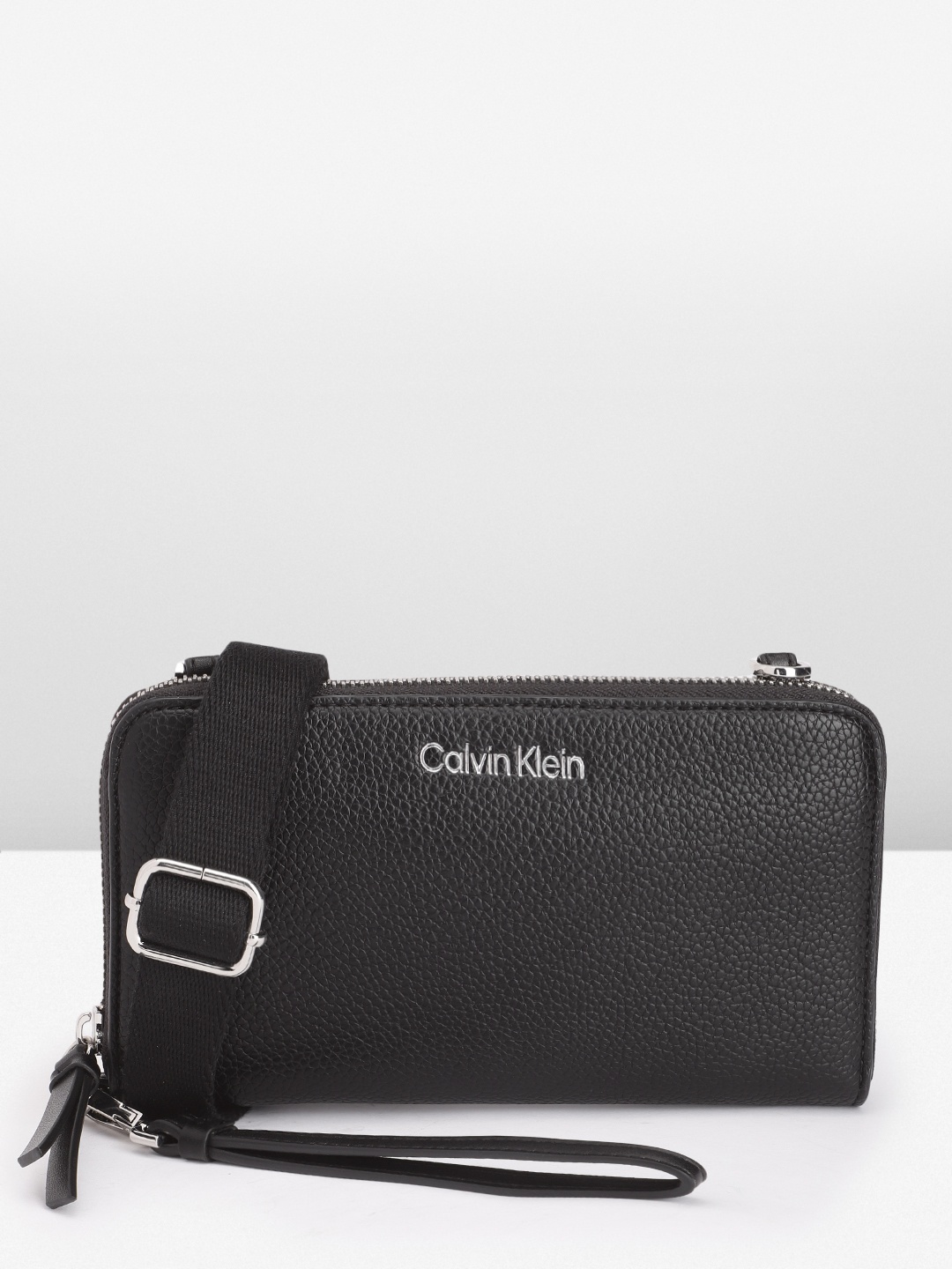 

Calvin Klein Women Abstract Textured PU Zip Around Wallet With Sling Strap & Wrist Loop, Black