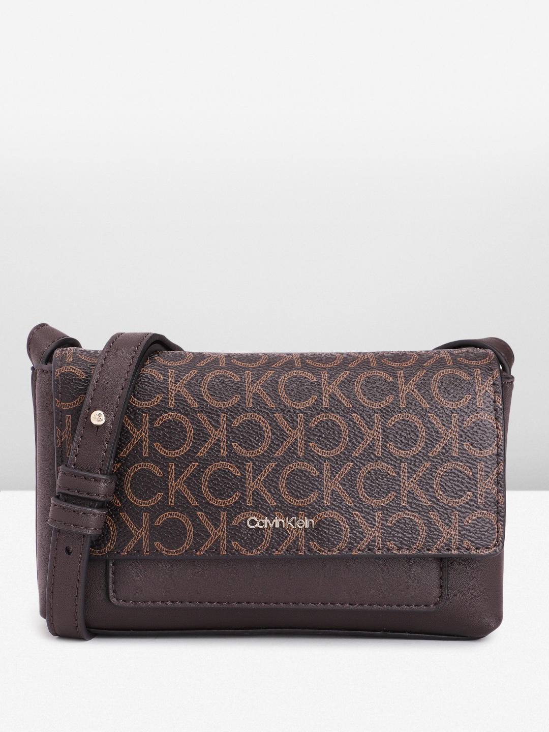 

Calvin Klein Brand Logo Print PU Small Structured Sling Bag, Brown