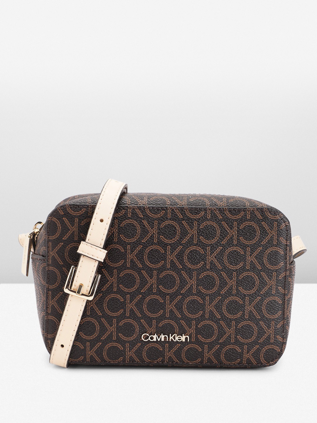 

Calvin Klein Brand Logo Print PU Structured Sling Bag, Brown