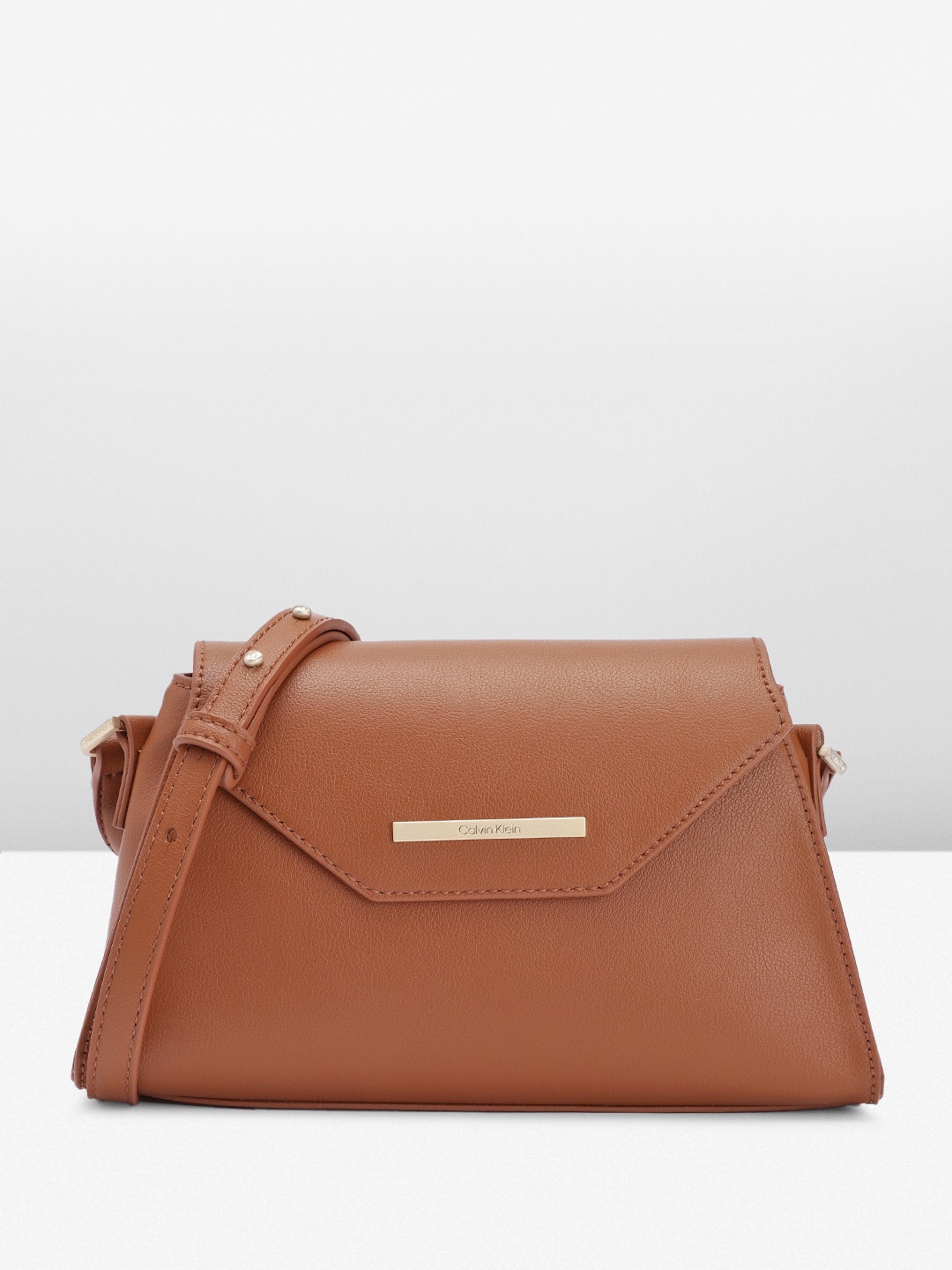 

Calvin Klein Women Solid Sling Bag, Brown