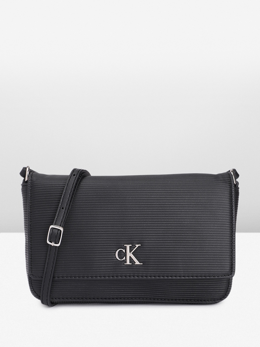 

Calvin Klein Textured Sling Bag, Black