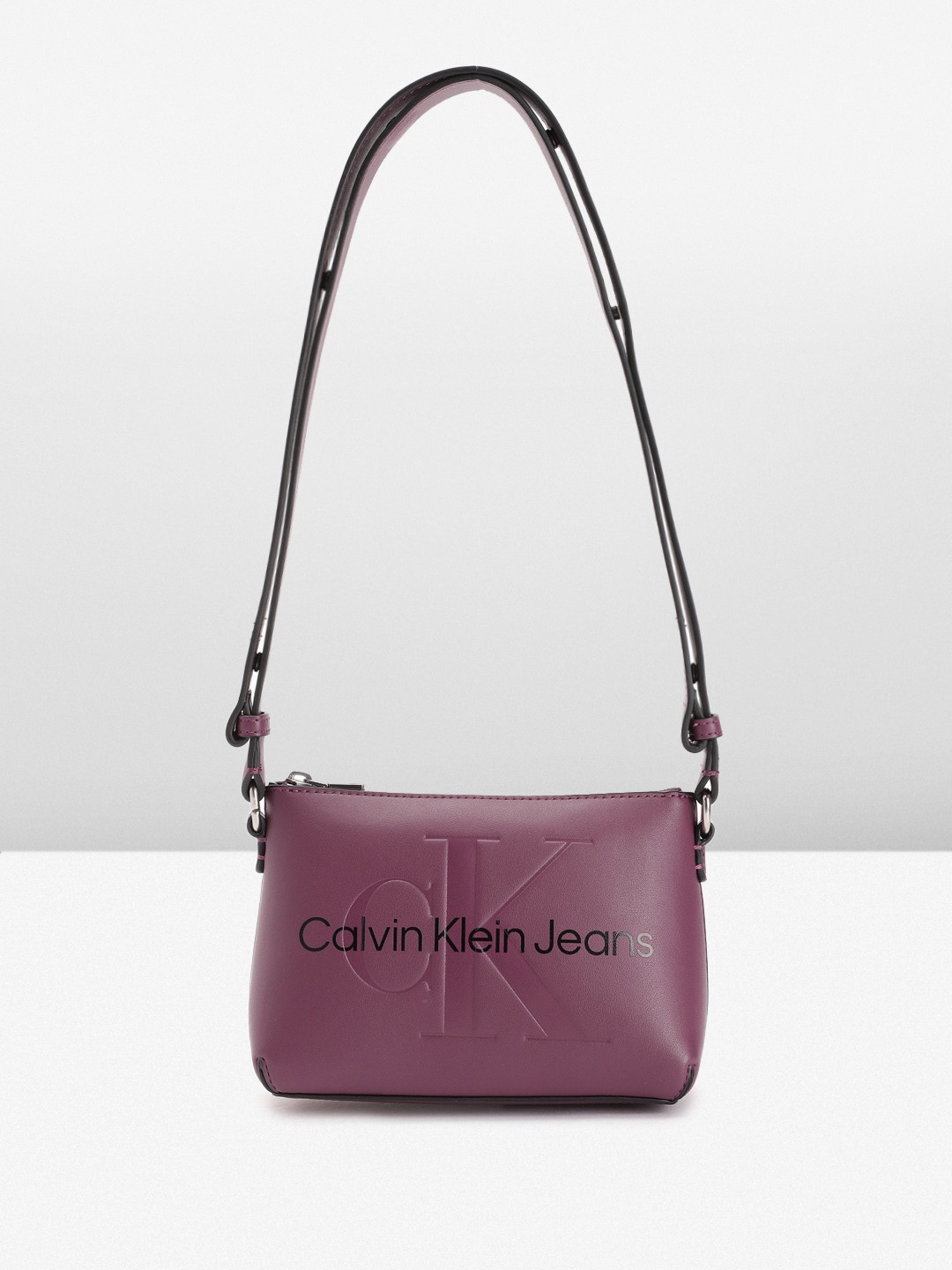 

Calvin Klein Brand Logo Printed Structured Sling Bag, Purple