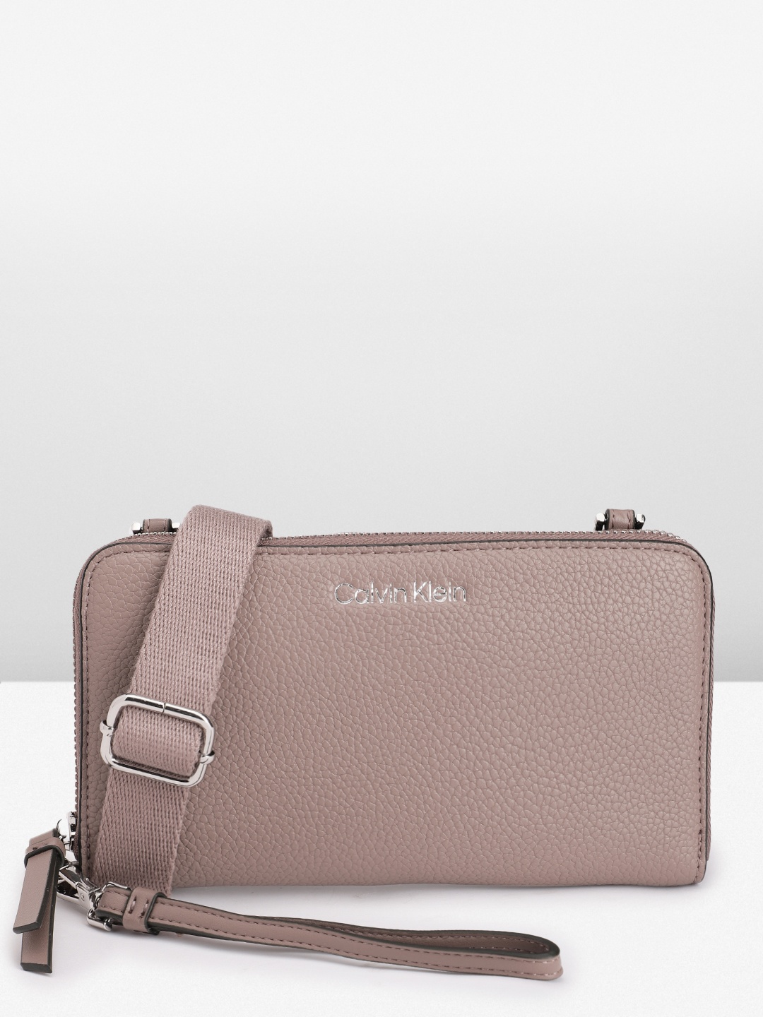 

Calvin Klein Women Abstract Textured PU Zip Around Wallet With Sling Strap & Wrist Loop, Taupe