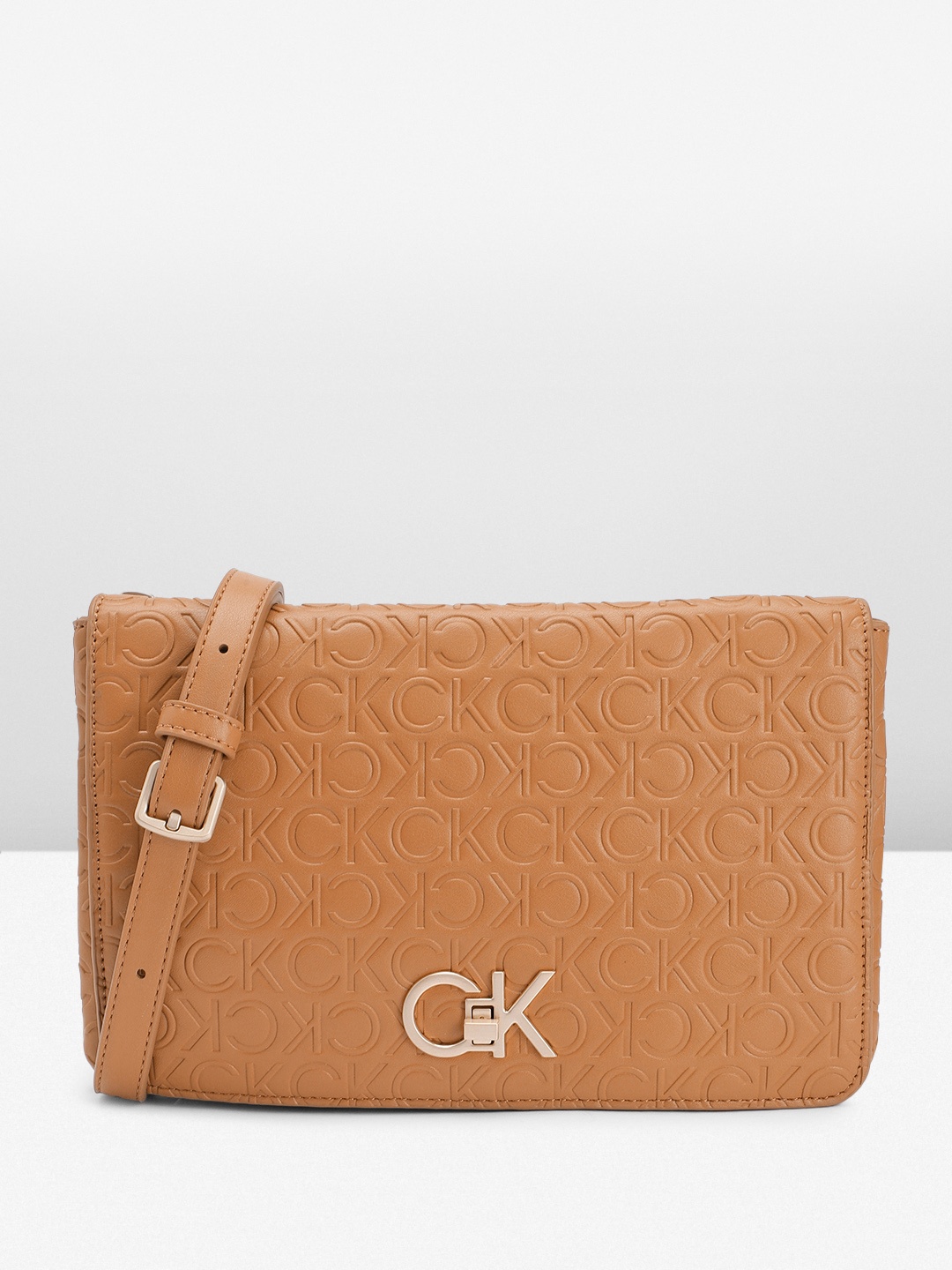 

Calvin Klein Textured Sling Bag, Brown